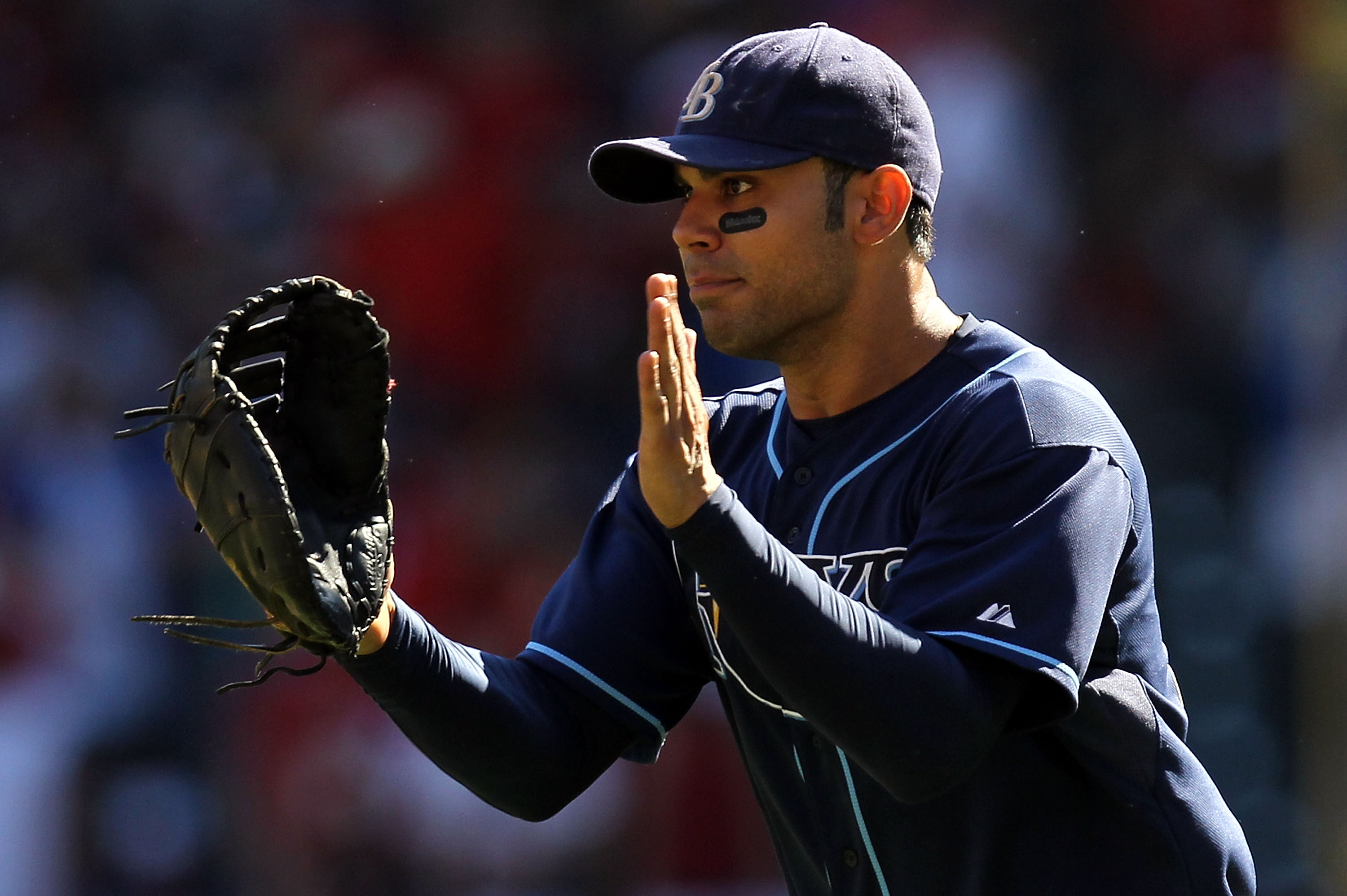 ARLINGTON, TX - OCTOBER 10:  Carlos Pena #23 of the Tampa Bay Rays celebrates after a 5-2 win against the Texas Rangers during game 4 of the ALDS at Rangers Ballpark in Arlington on October 10, 2010 in Arlington, Texas.  (Photo by Ronald Martinez/Getty Im