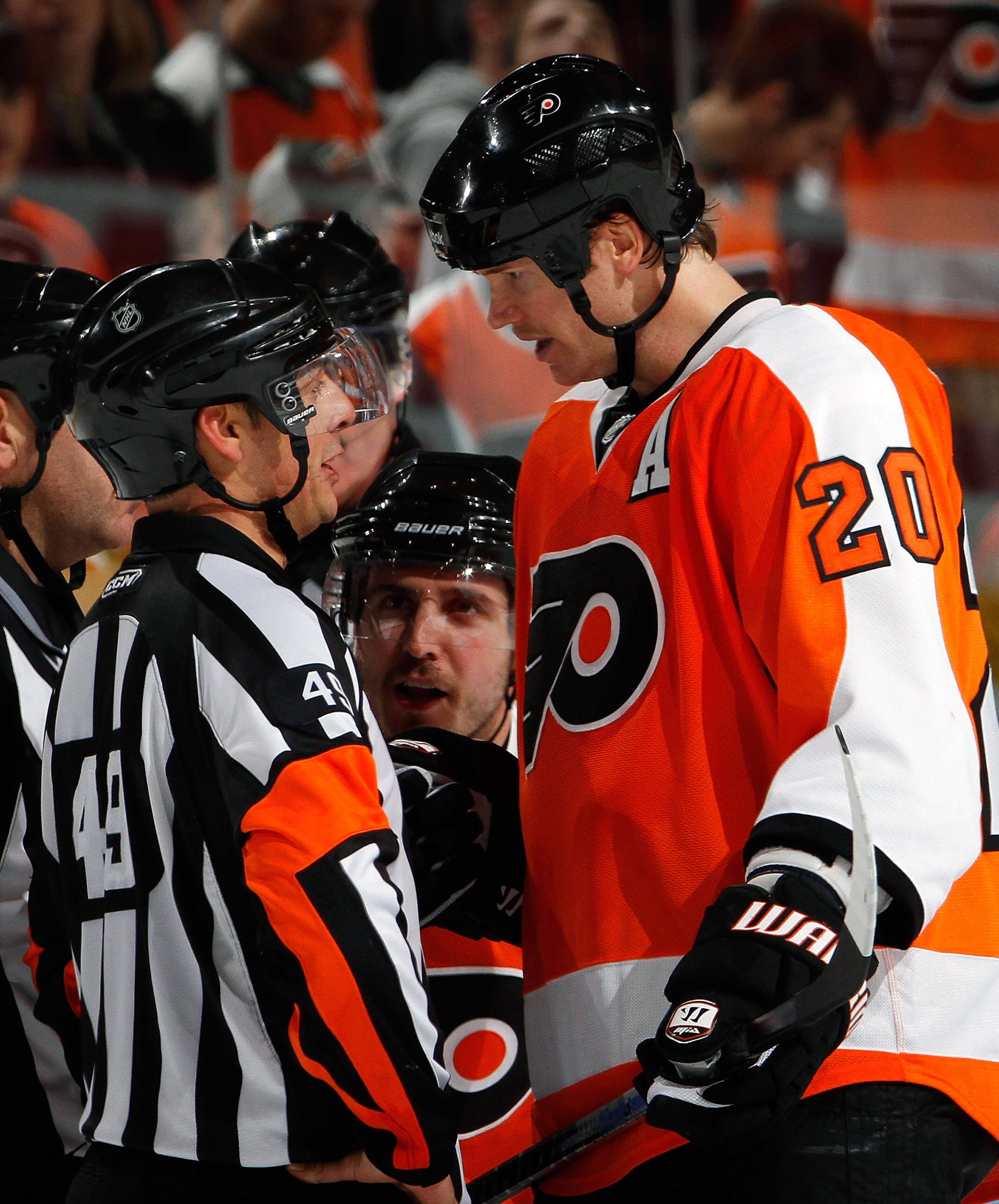 PHILADELPHIA - NOVEMBER 26:  Chris Pronger #20 of the Philadelphia Flyers argues with referee Ghislain Hebert #49 after the officials disallowed what appeared to be a Flyers goal in the overtime period against the Calgary Flames during a hockey game at th