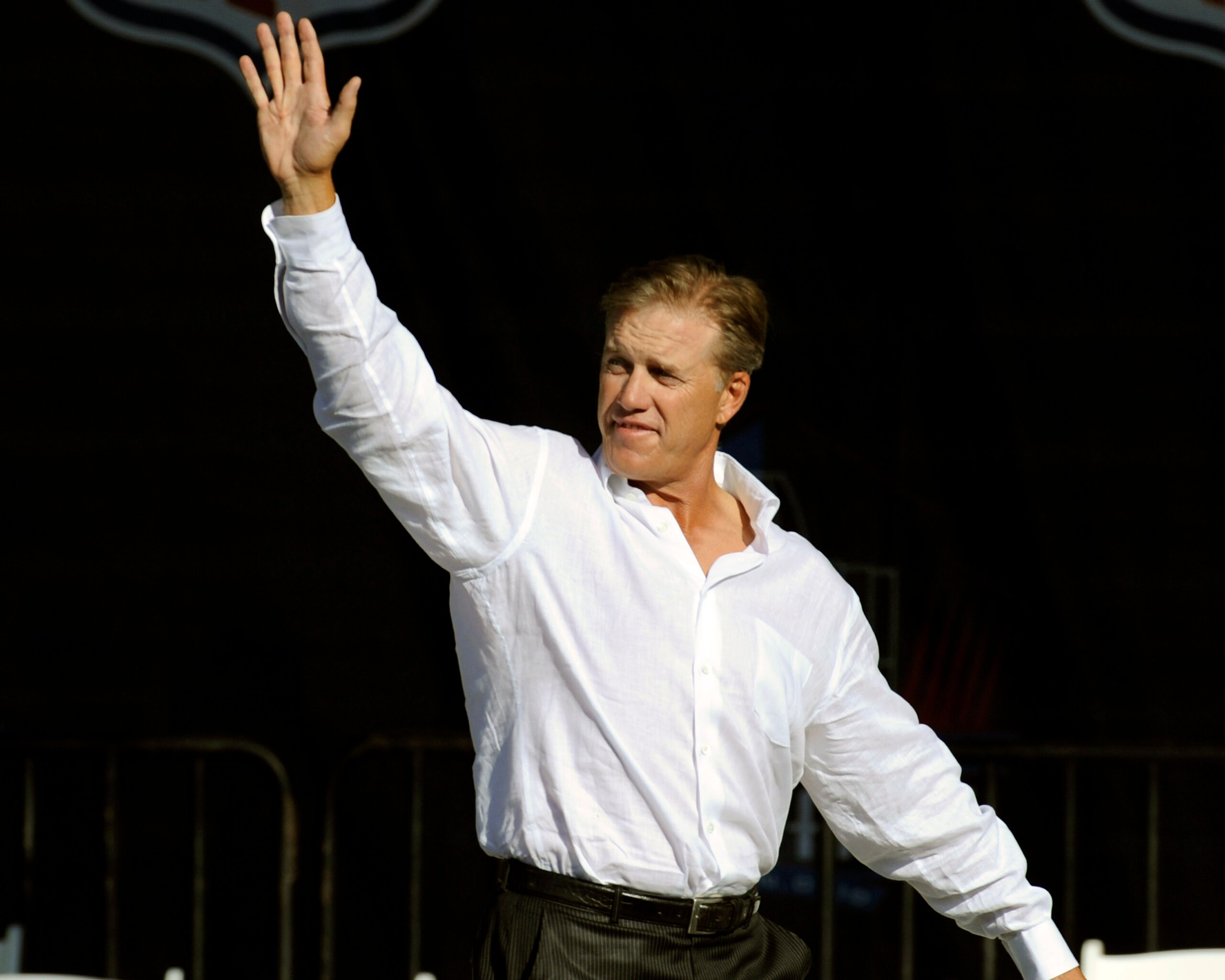 CANTON, OH - AUGUST 2:  John Elway of the Denver Broncos waves to fans during the Class of 2008 Pro Football Hall of Fame Enshrinement Ceremony at Fawcett Stadium on August 2, 2008 in Canton, Ohio.   (Photo by Al Messerschmidt/Getty Images)