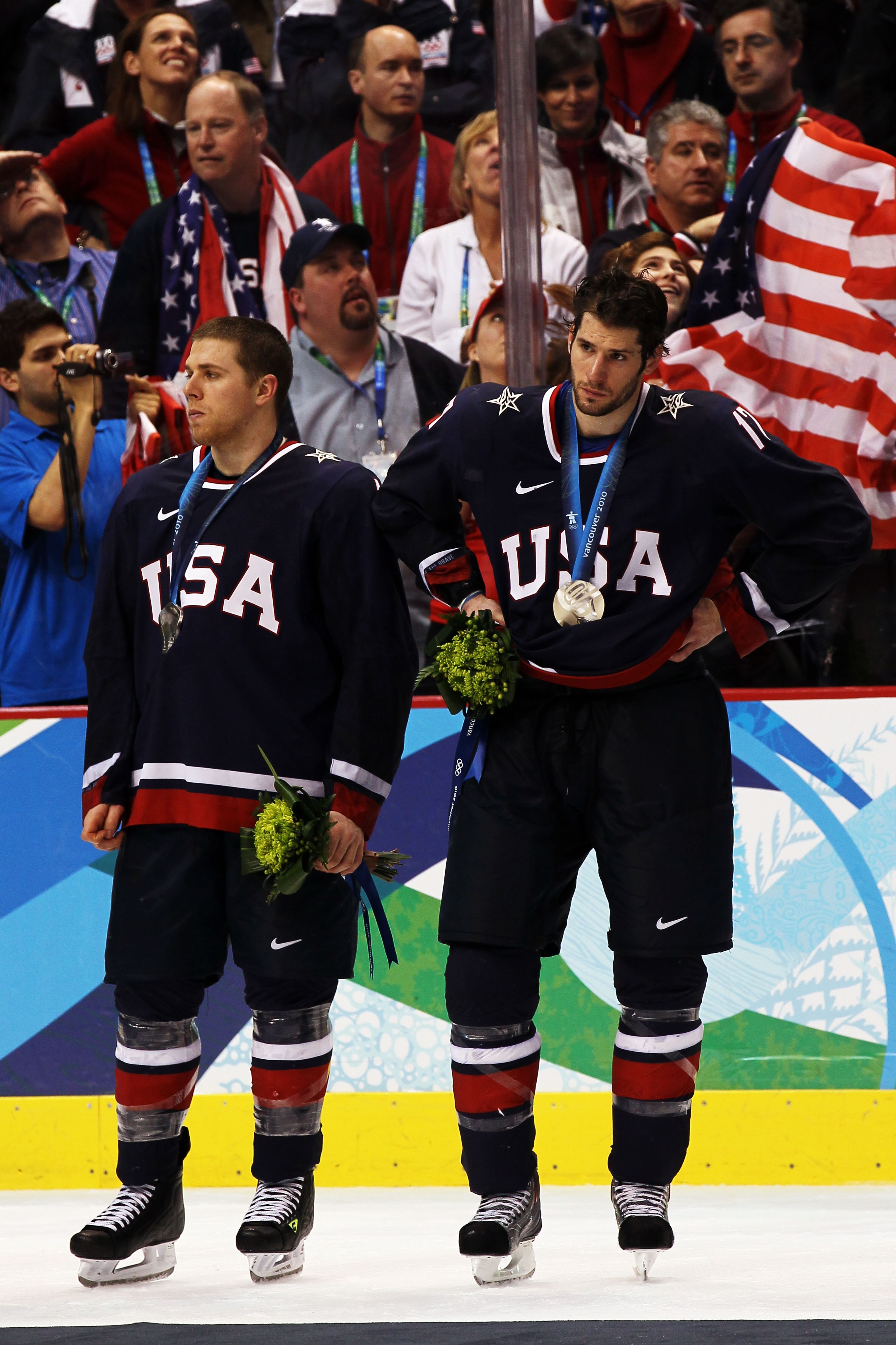 VANCOUVER, BC - FEBRUARY 28:  A dejected Ryan Kesler (R) #17 of the United States looks on after receiving the silver medal during the ice hockey men's gold medal game between USA and Canada on day 17 of the Vancouver 2010 Winter Olympics at Canada Hockey