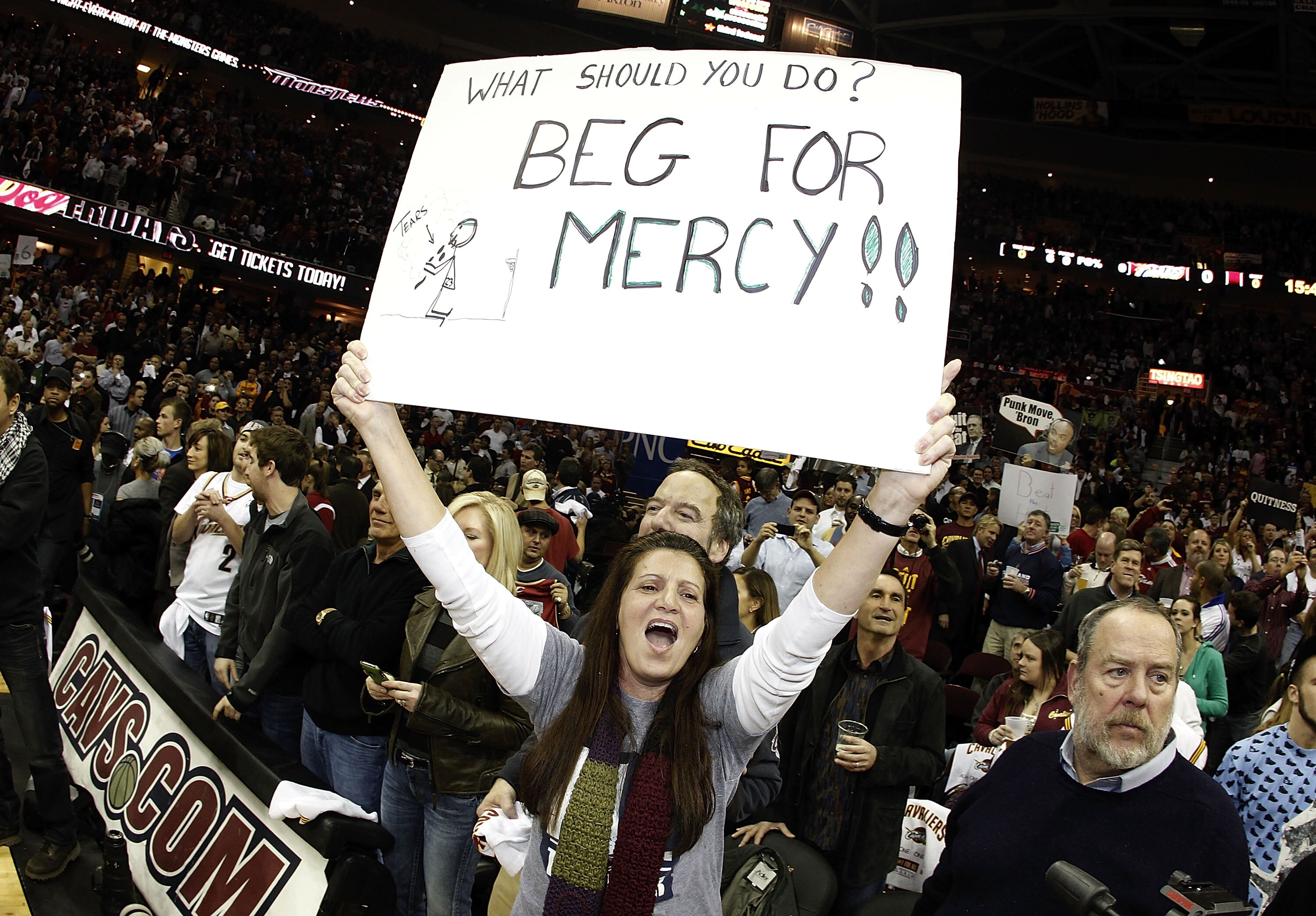 CLEVELAND, OH - DECEMBER 02:  Fans hold up signs prior to the Cleveland Cavaliers playing the Miami Heat at Quicken Loans Arena on December 2, 2010 in Cleveland, Ohio. NOTE TO USER: User expressly acknowledges and agrees that, by downloading and or using