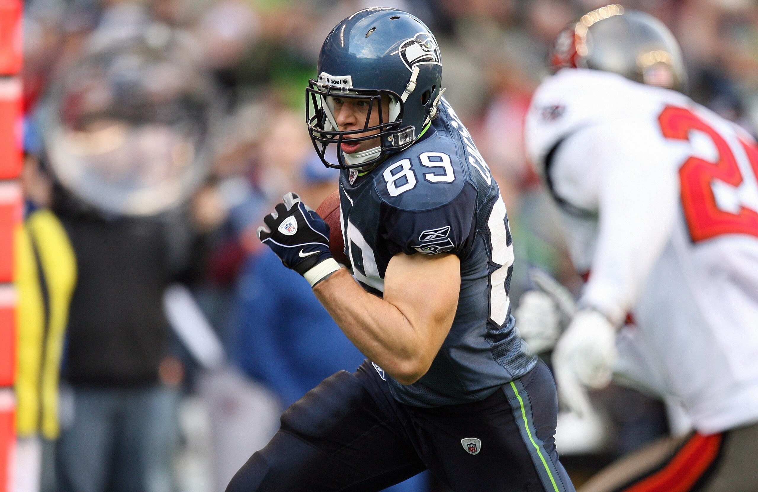 SEATTLE - DECEMBER 20:  John Carlson #89 of the Seattle Seahawks runs with the ball for yardage during their game against the Tampa Bay Buccaneers on December 20, 2009 at Qwest Field in Seattle, Washington. The Buccaneers defeated the Seahawks 24-7. (Phot
