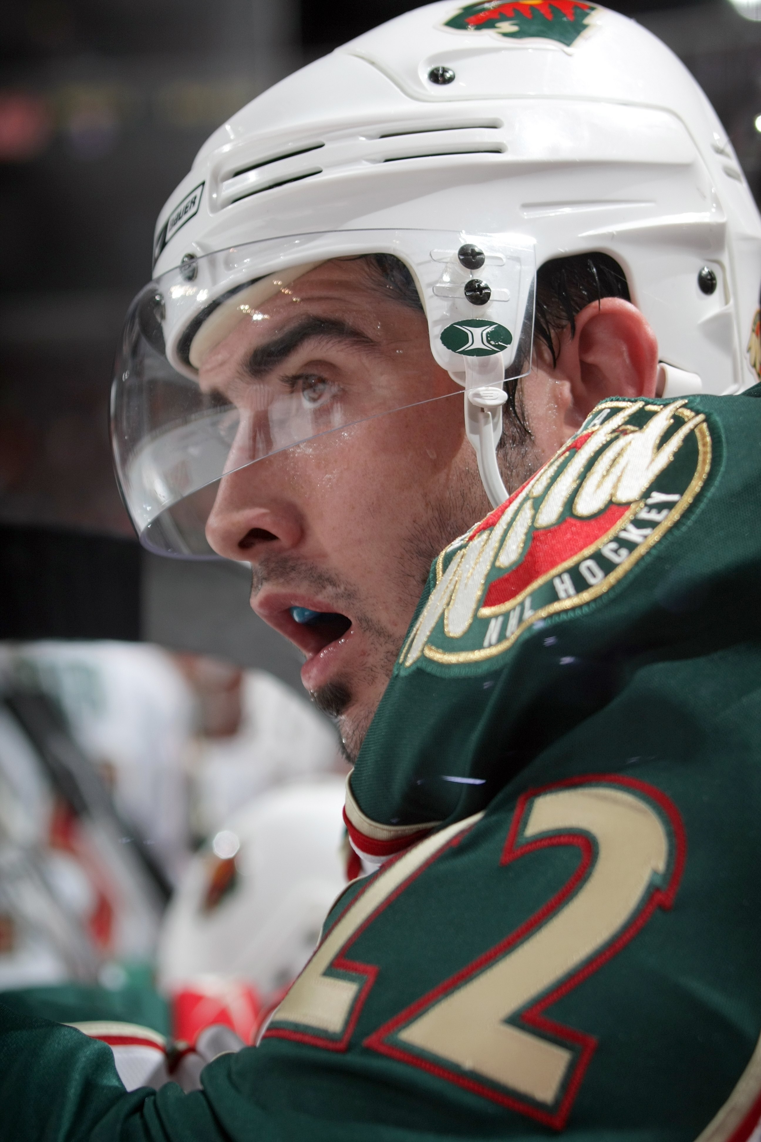 PHILADELPHIA - SEPTEMBER 29:  Cal Clutterbuck #22 of the Minnesota Wild looks on from the bench area during the preseason NHL game against the Philadelphia Flyers at the Wachovia Center on September 29, 2009 in Philadelphia, Pennsylvania.  The Wild defeat