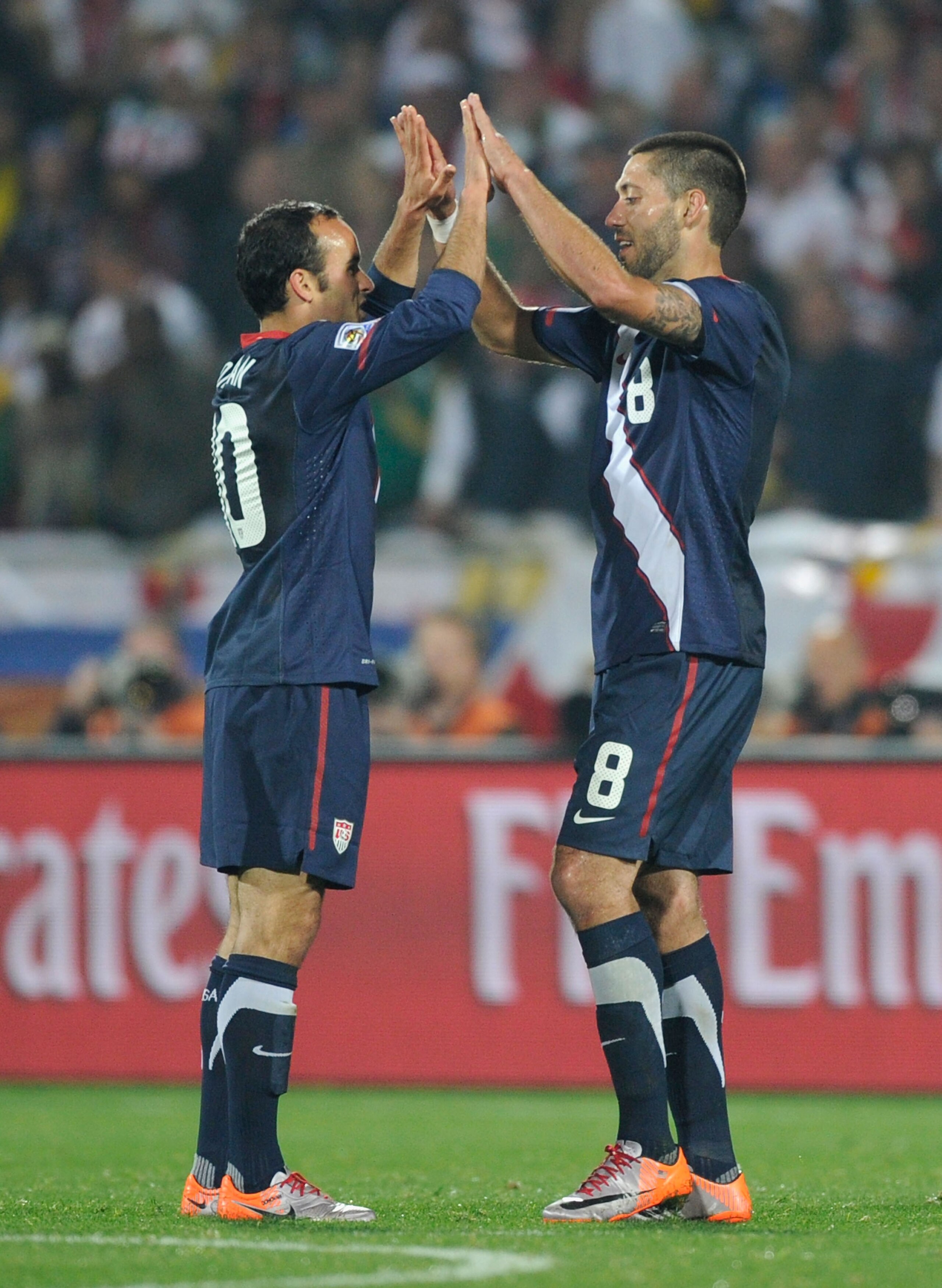 RUSTENBURG, SOUTH AFRICA - JUNE 12:  Clint Dempsey (R) and Landon Donovan of the United States celebrate at the final whistle during the 2010 FIFA World Cup South Africa Group C match between England and USA at the Royal Bafokeng Stadium on June 12, 2010