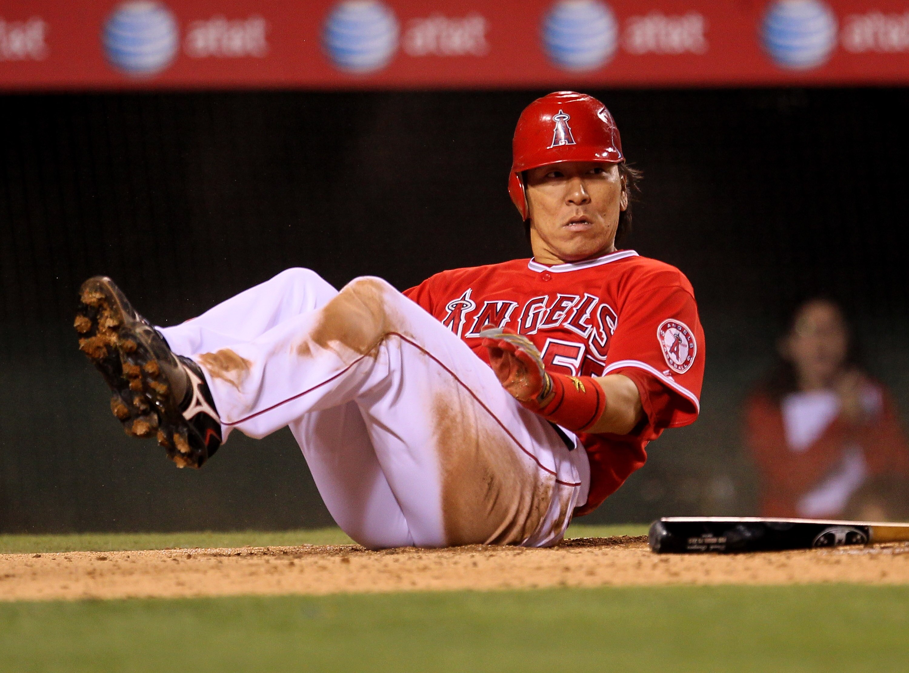 ANAHEIM, CA - SEPTEMBER 21:  Hideki Matsui #55 of the Los Angeles Angels of Anaheim slides into home to score a run on a fielder's choice in the fourth inning against the Texas Rangers on September 21, 2010 at Angel Stadium in Anaheim, California.  (Photo