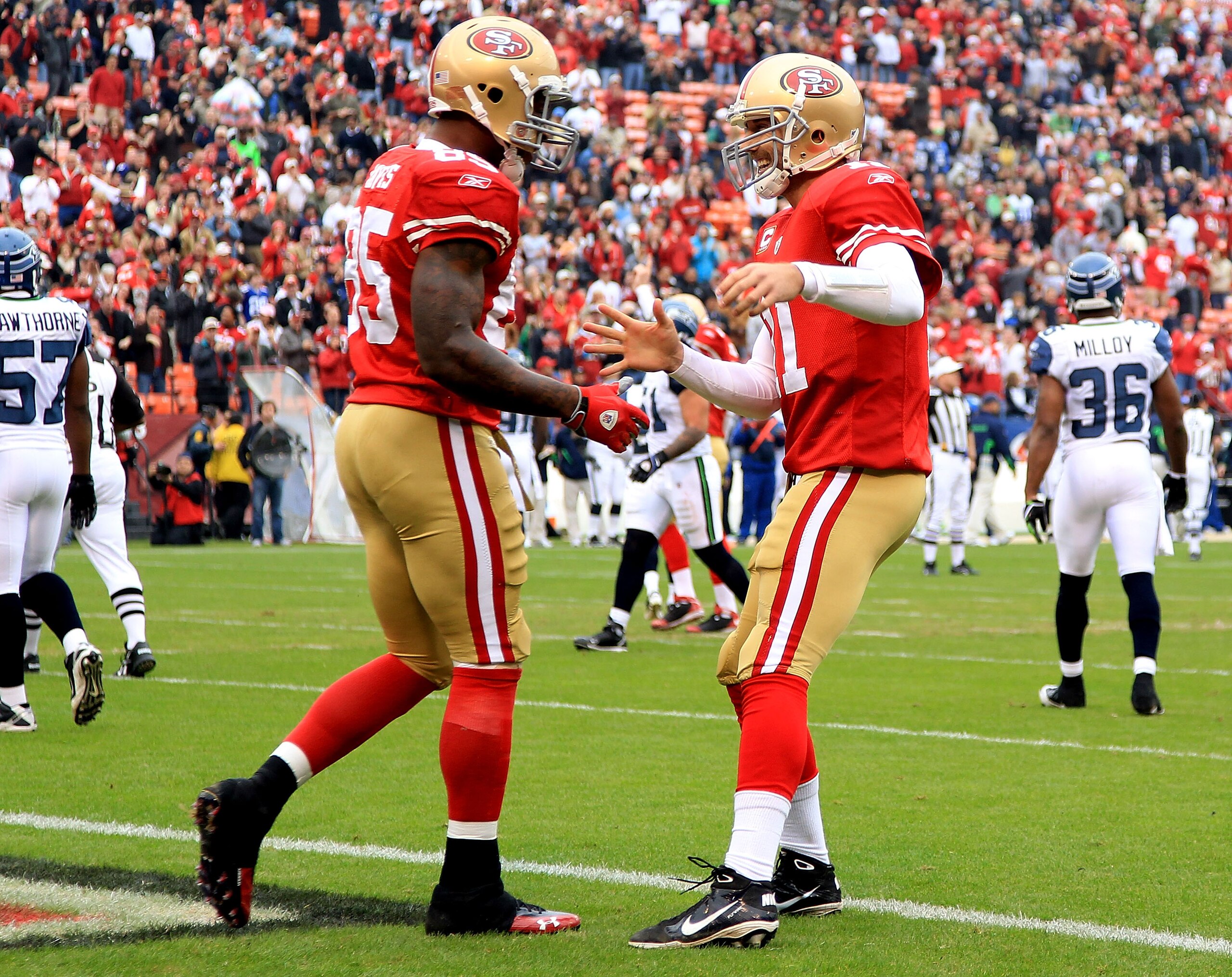 SAN FRANCISCO - DECEMBER 12:    Vernon Davis #85 of the San Francisco 49ers celebrates with Alex Smith #11 after a catching a touchdown against the Seattle Seahawks during an NFL game at Candlestick Park on December 12, 2010 in San Francisco, California.