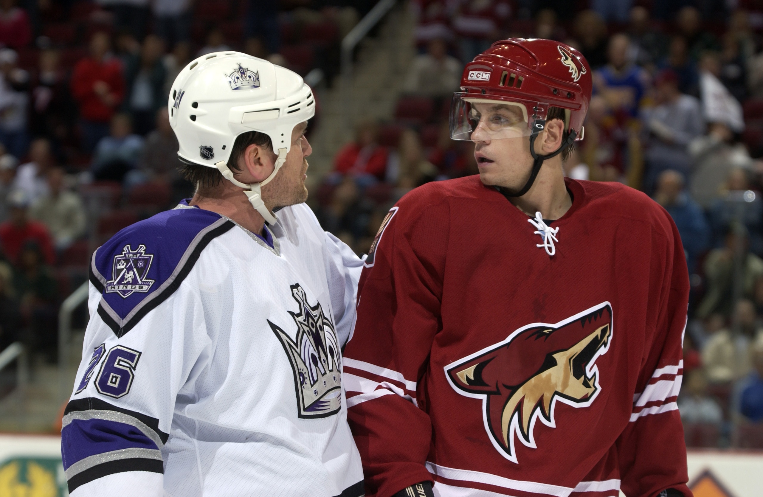 PHOENIX - DECEMBER 31:  Brad Ference #45 of the Phoenix Coyotes and Trent Klatt #26 of the Los Angeles Kings have a few words during the game on December 31, 2003 at Glendale Arena in Glendale, Arizona. The Coyotes defeated the Kings 4 - 0. (Photo by Barr