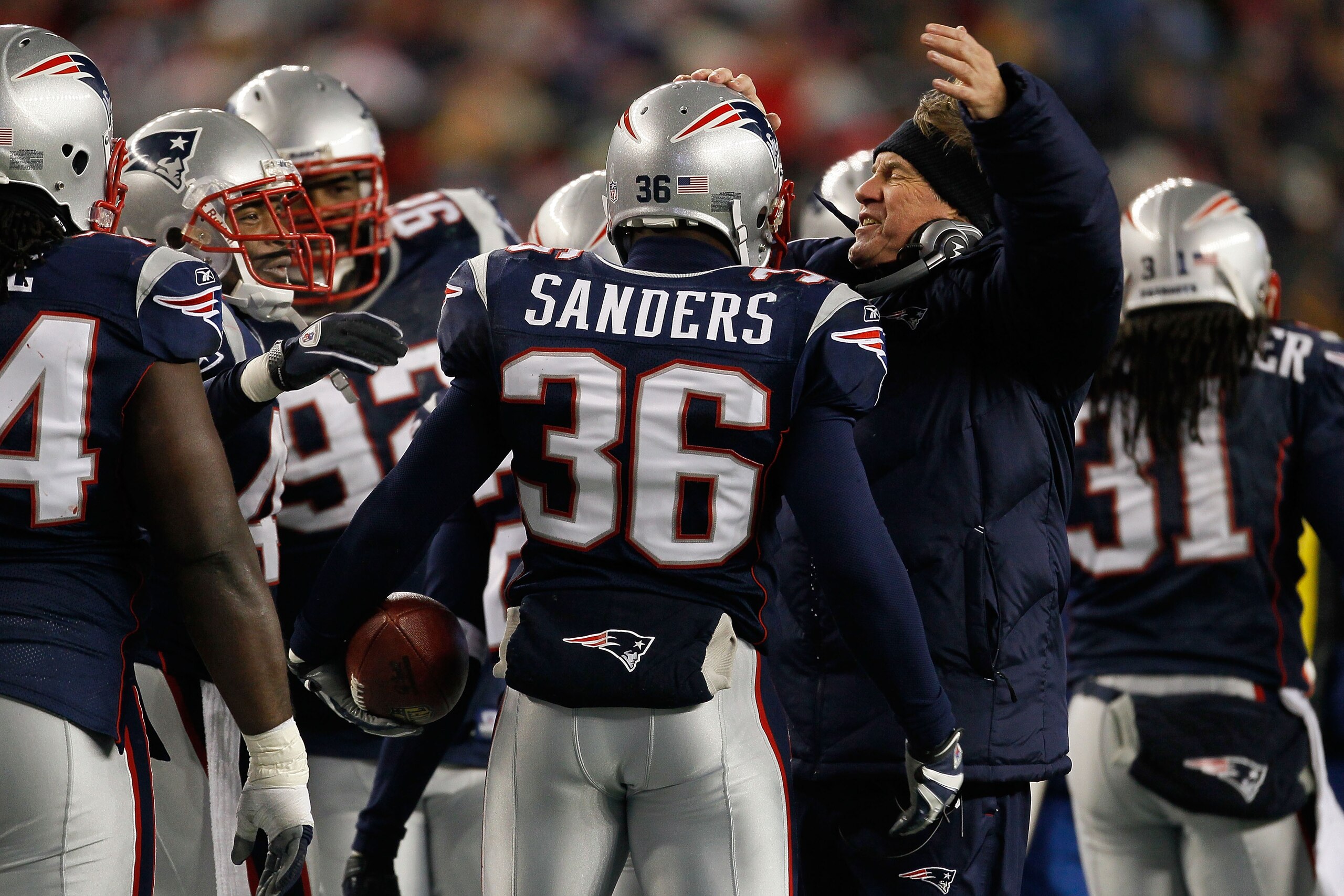 FOXBORO, MA - DECEMBER 06:  James Sanders #36 and head coach Bill Belichick of the New England Patriots celebrate after Sanders intercepted a pass against the New York Jets at Gillette Stadium on December 6, 2010 in Foxboro, Massachusetts.  (Photo by Jim