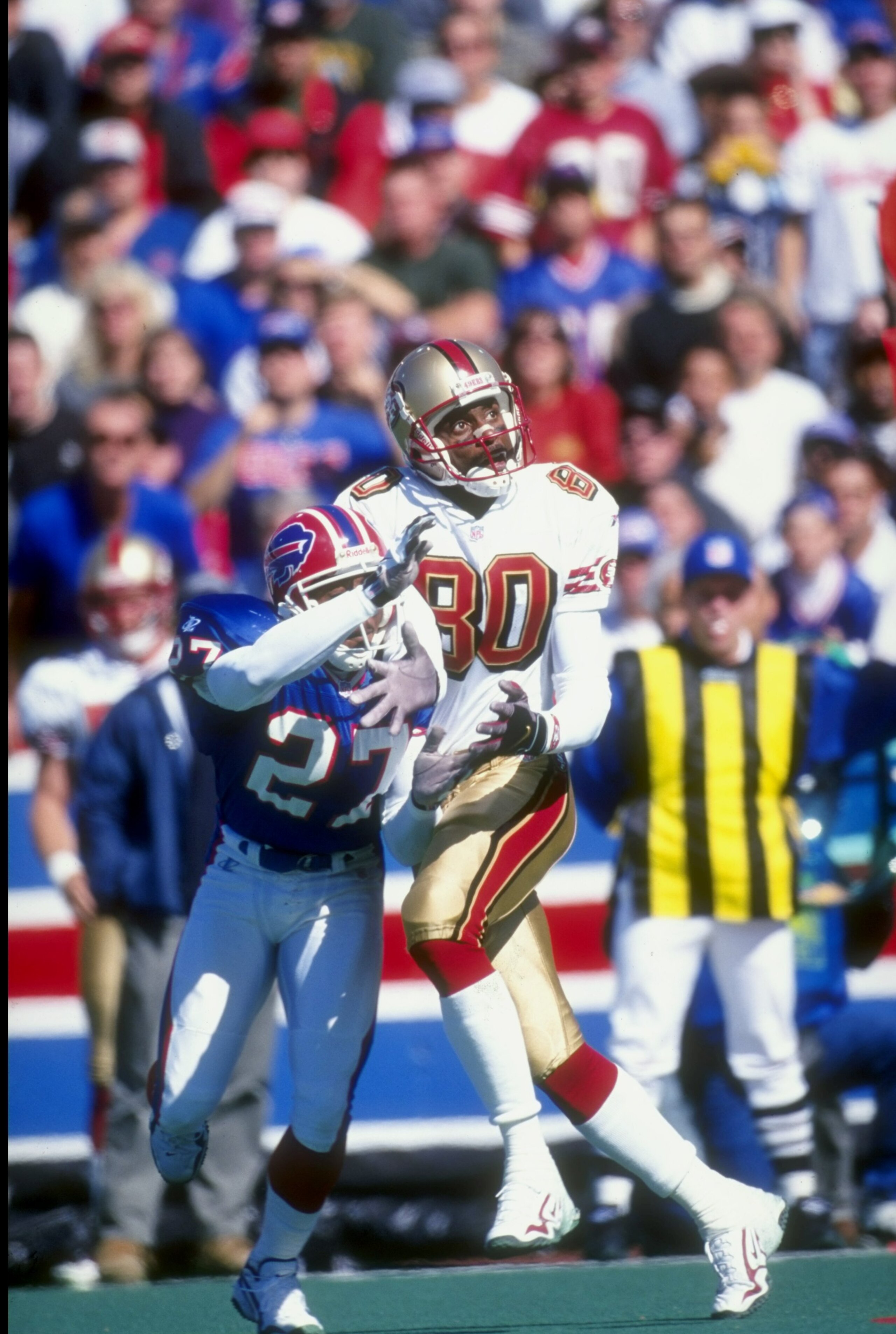 4 Oct 1998:  Wide Receiver Jerry Rice #80 of the San Francisco 49ers attempts to catch the ball in front of Ken Irvin #27 of the Buffalo Bills during a game at the Bills Stadium in Orchard Park, New York. The Bills defeated the 49ers 26-21. Mandatory Cred