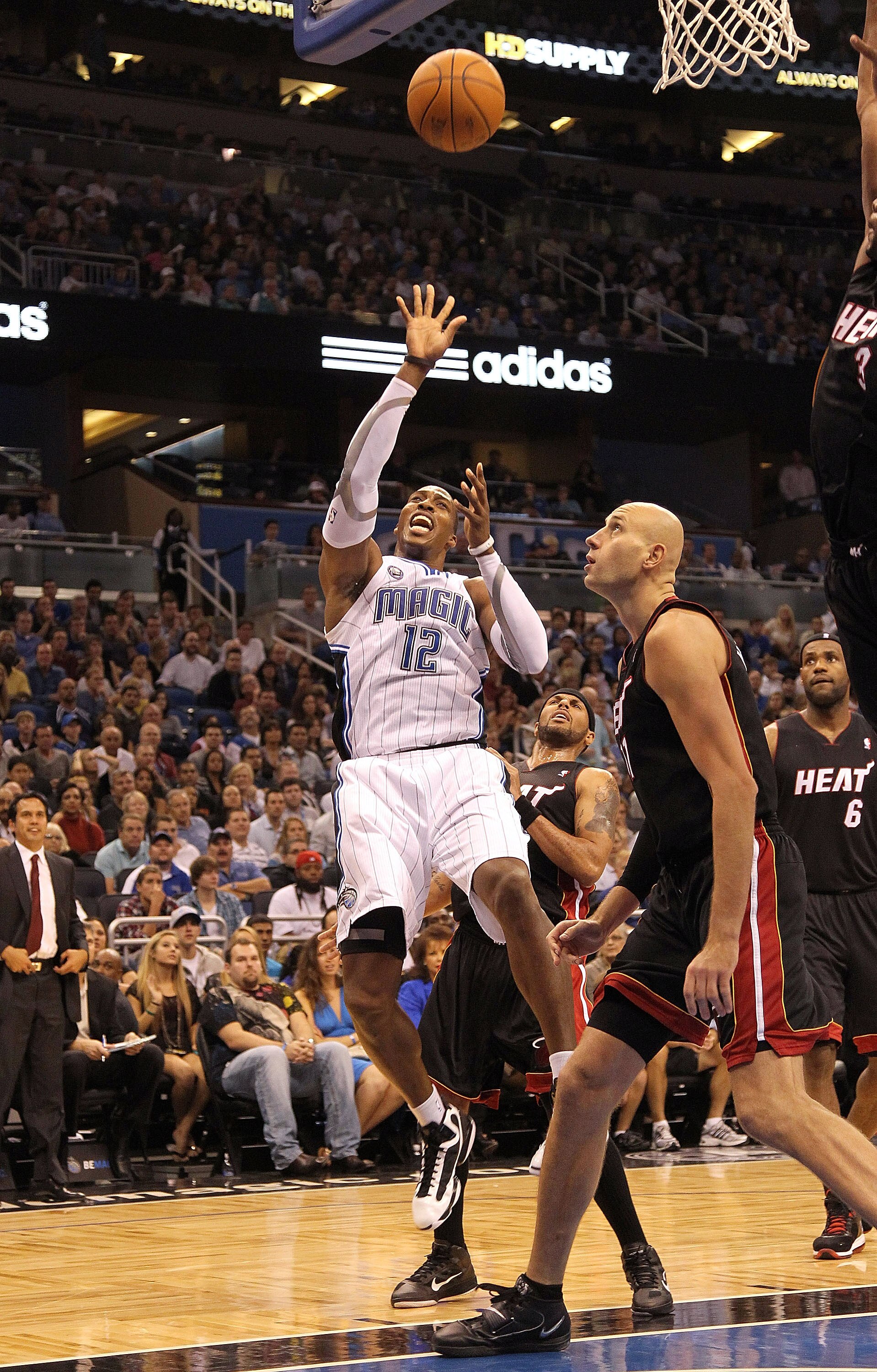 ORLANDO, FL - NOVEMBER 24:  Dwight Howard #12 of the Orlando Magic shoots over Zydrunas Ilgauskas #11 of the Miami Heat during a game at Amway Arena on November 24, 2010 in Orlando, Florida. NOTE TO USER: User expressly acknowledges and agrees that, by do