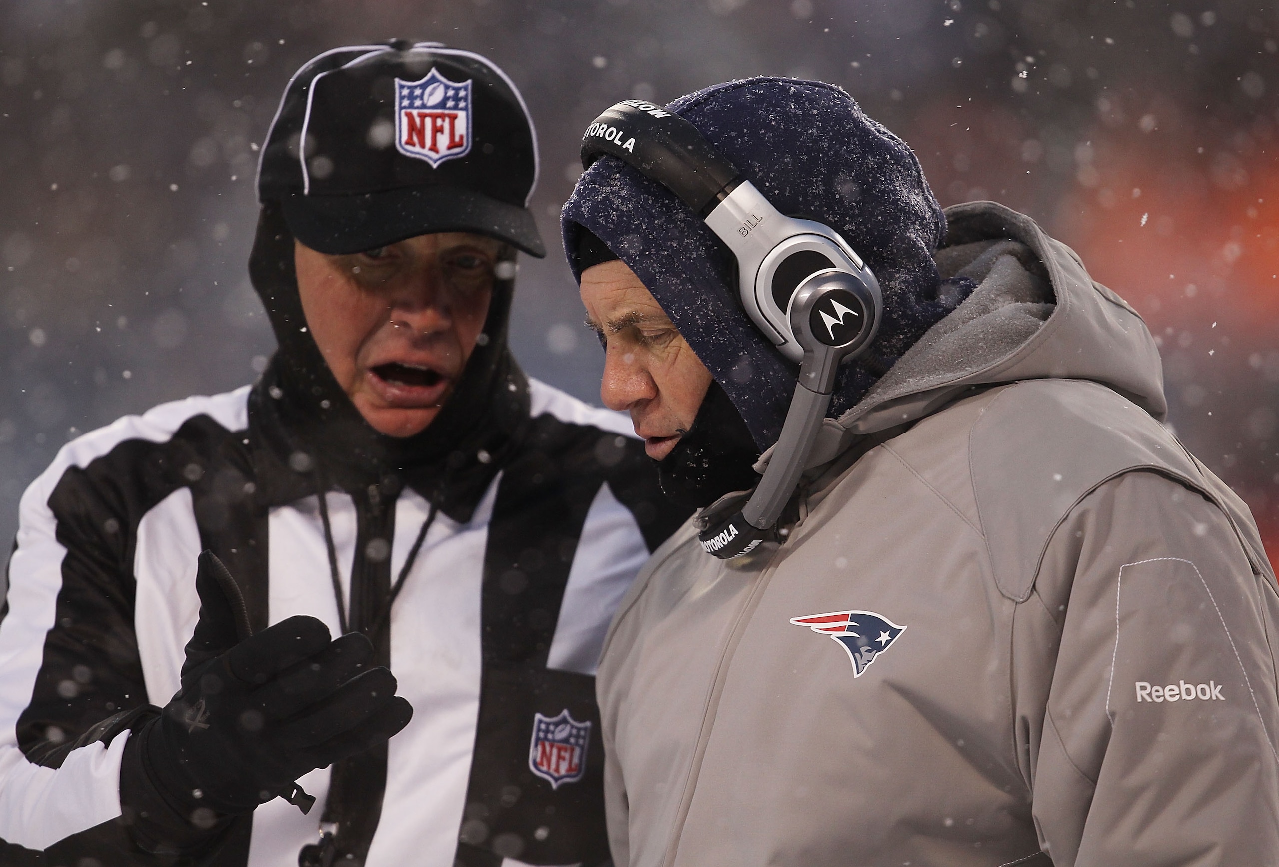 CHICAGO, IL - DECEMBER 12: Head coach Bill Belichick of the New England Patriots talks with a referee during a game against the Chicago Bears at Soldier Field on December 12, 2010 in Chicago, Illinois. The Patriots defeated the Bears 36-7. (Photo by Jonat