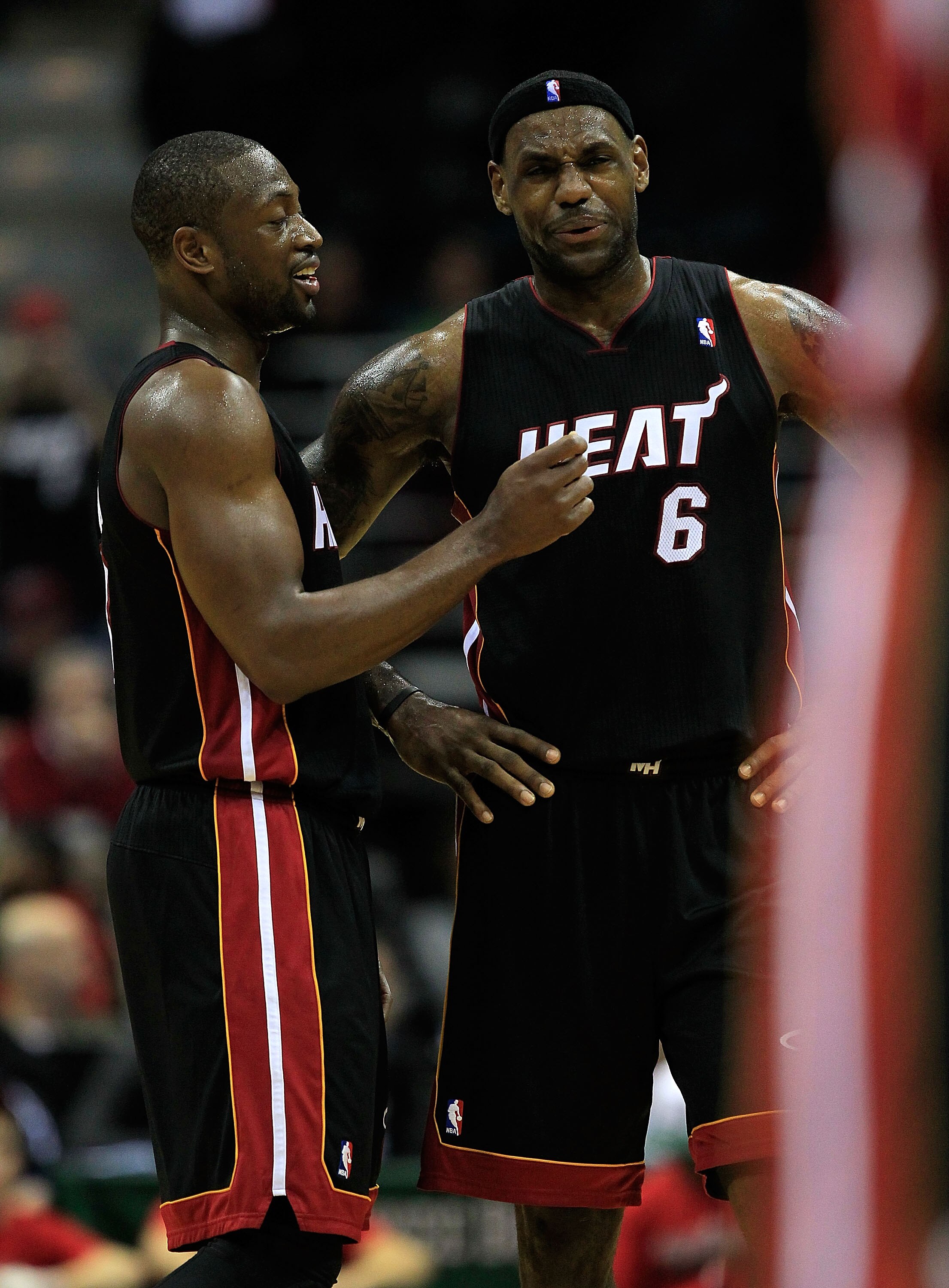 MILWAUKEE, WI - DECEMBER 06: (L-R) Dwyane Wade #3 and LeBron James #6 of the Miami Heat share aluagh at the end of a game against the Milwaukee Bucks at the Bradley Center on December 6, 2010 in Milwaukee, Wisconsin. The Heat defeated the Bucks 88-78. NOT
