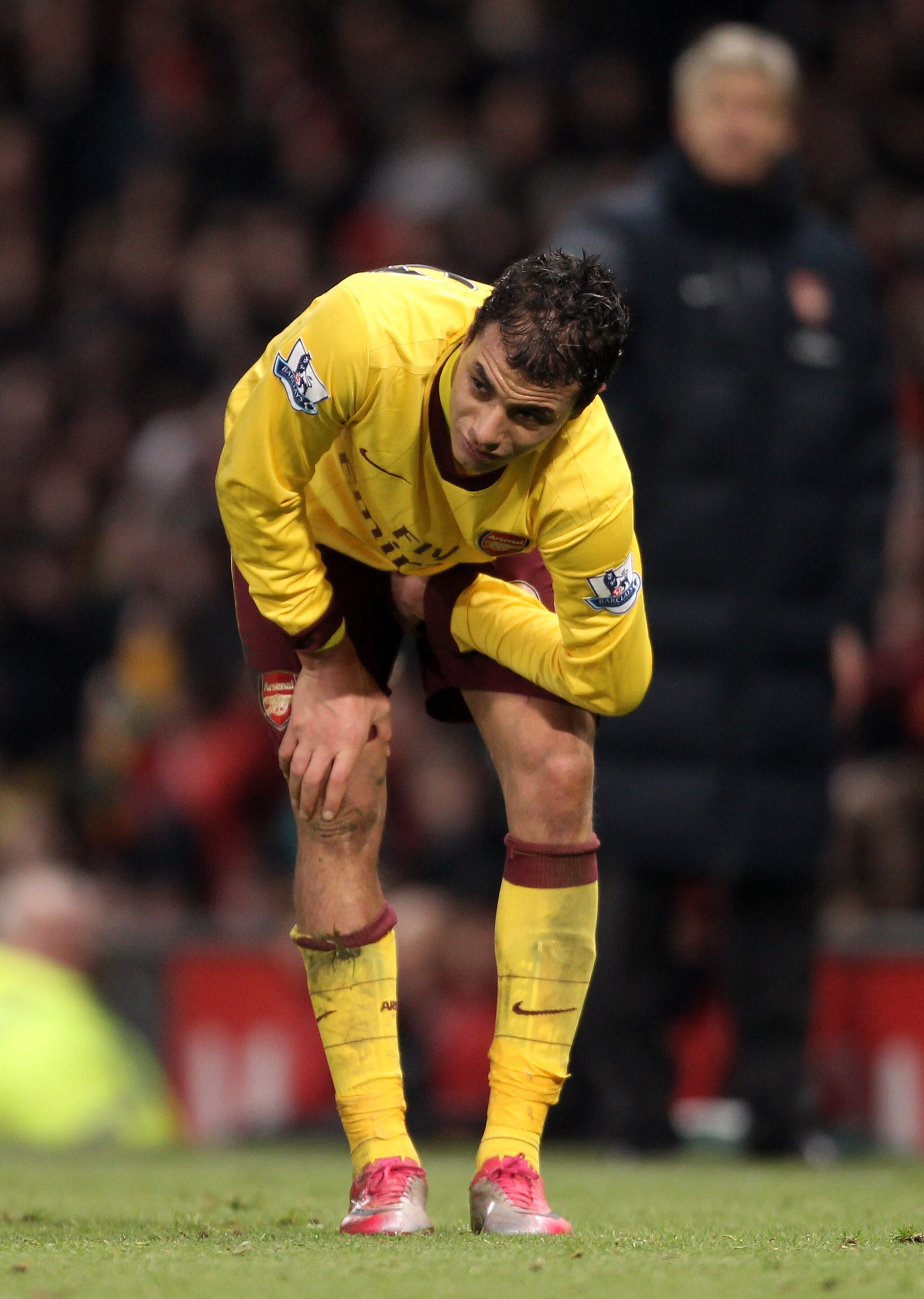MANCHESTER, UNITED KINGDOM - DECEMBER 13: Marouane Chamakh of Arsenal holds his leg after sustaining an injury during the Barclays Premier League match between Manchester United and Arsenal at Old Trafford on December 13, 2010 in Manchester, England. (P MANCHESTER, UNITED KINGDOM - DECEMBER 13: Marouane Chamakh of Arsenal holds his leg after sustaining an injury during the Barclays Premier League match between Manchester United and Arsenal at Old Trafford on December 13, 2010 in Manchester, England. (P