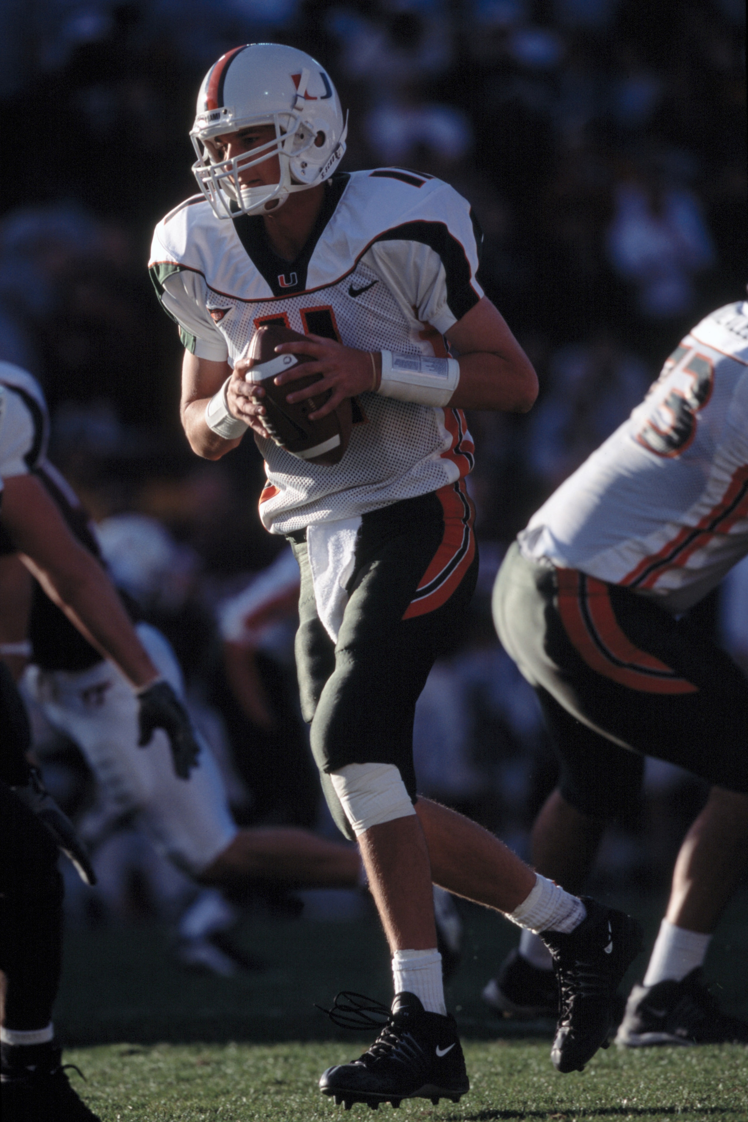 1 Dec 2001:  Quarterback Ken Dorsey #11 of the Miami Hurricanes runs with the ball during the NCAA game against the Virginia Tech Hokies at Lane Stadium in Blacksburg, Virginia.  Miami defeated Virginia Tech 26-24.  Mandatory Credit:  Criag Jones/Getty Im