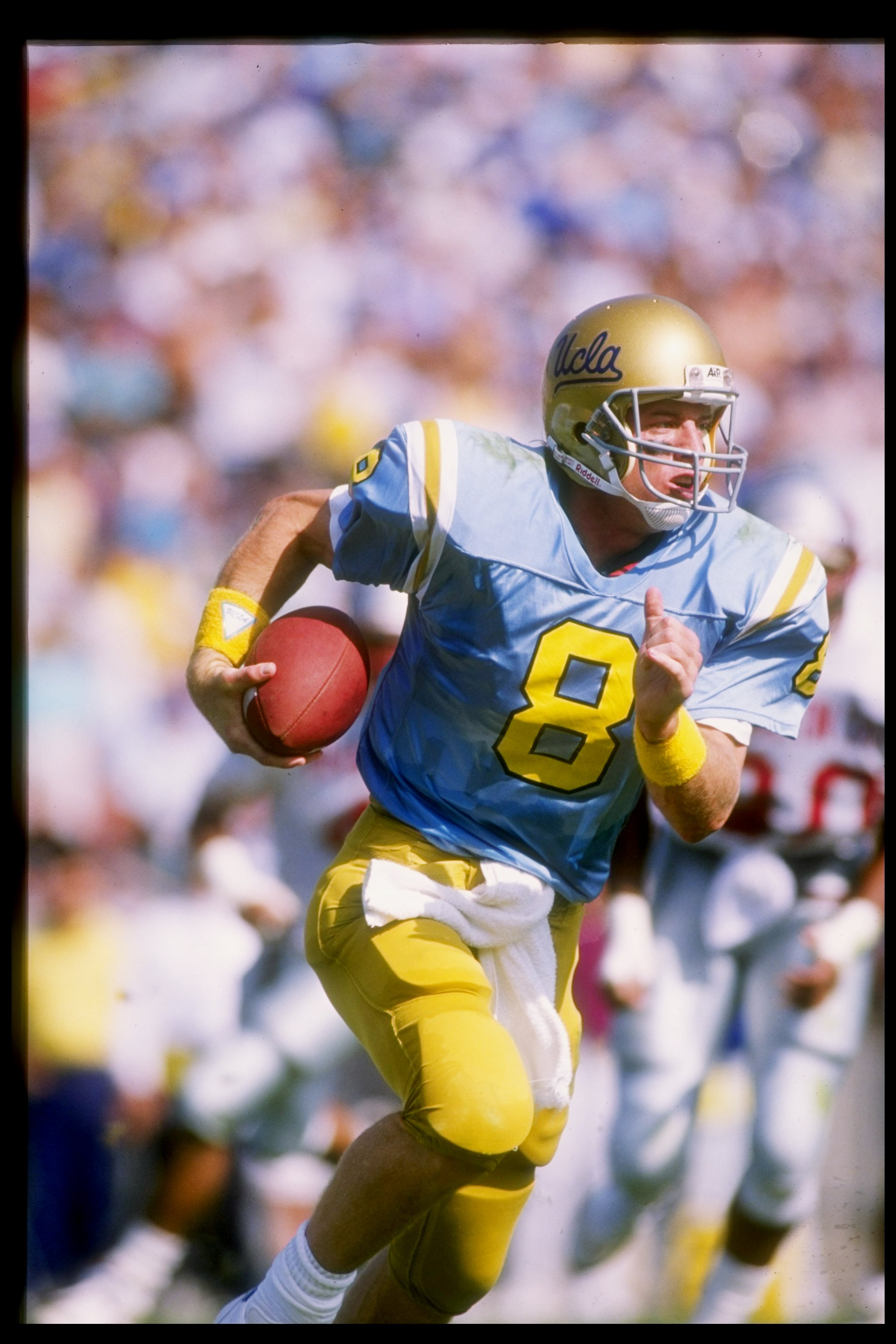 29 Oct 1988:  Quarterback Troy Aikman of the UCLA Bruins runs down the field during a game against the Washington State Cougars at the Rose Bowl in Pasadena, California.  Washington State won the game 34-30. Mandatory Credit: Mike Powell  /Allsport