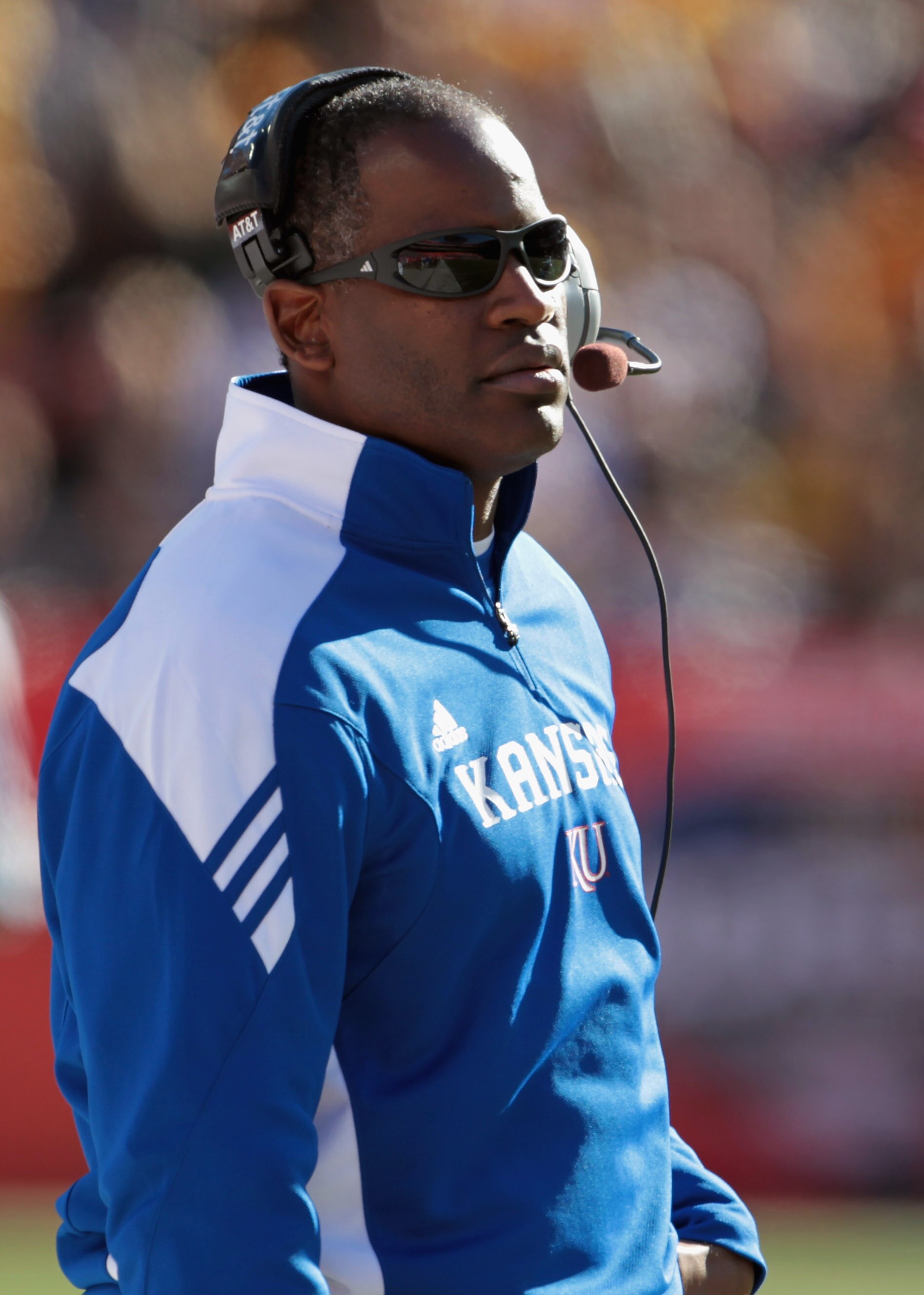 KANSAS CITY, MO - NOVEMBER 27:  Head coach Turner Gill of the Kansas Jayhawks coaches from the sidelines during the game against the Missouri Tigers on November 27, 2010 at Arrowhead Stadium in Kansas City, Missouri.  (Photo by Jamie Squire/Getty Images)