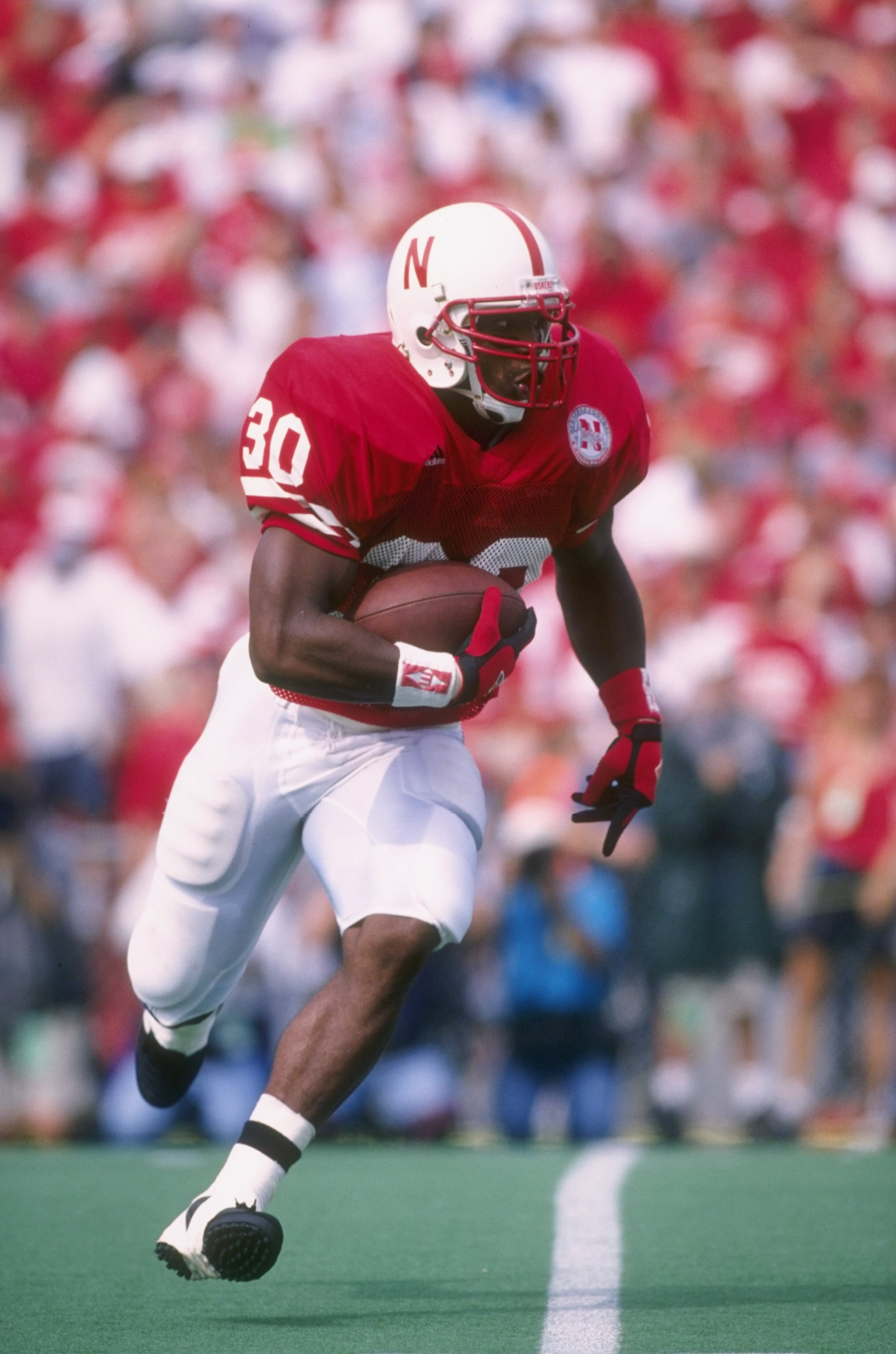 7 Sep 1996:  Running back Ahman Green of the Nebraska Cornhuskers looks up field as he makes a cut to the outside during a carry in the Cornhuskers 55-14 victory over the Michigan State Spartans at Memorial Stadium in Lincoln, Nebraska.  Mandatory Credit: