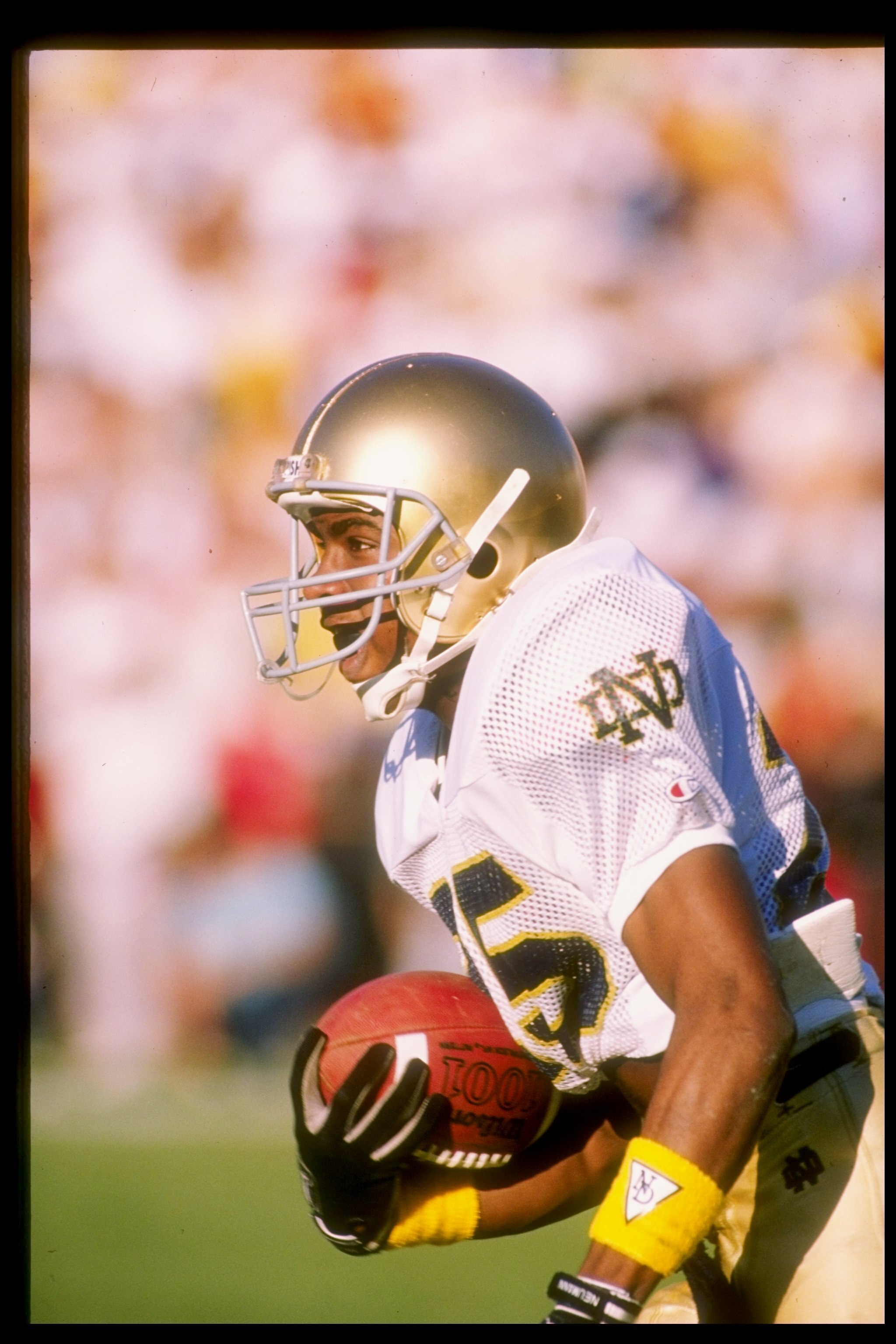 26 Nov 1988:  Flanker Raghib Ismail of the Notre Dame Fighting Irish runs down the field during a game against the Southern California Trojans at the Los Angeles Memorial Coliseum in Los Angeles, California.  Notre Dame won the game 27-10. Mandatory Credi