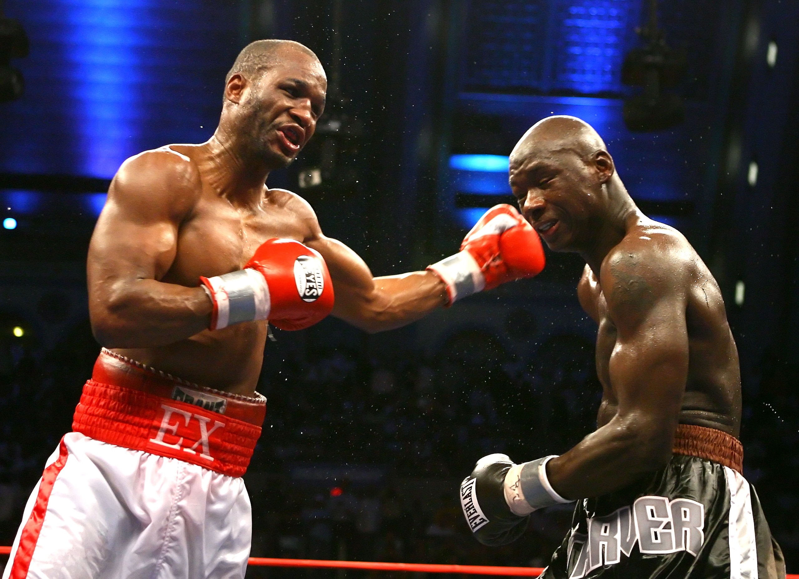 ATLANTIC CITY, NJ - JUNE 10:  Bernard Hopkins (L) connects with a left hand hook against Antonio Tarver during their IBO Light Heavyweight Championship fight at Boardwalk Hall on June 10, 2006 in Atlantic City, New Jersey.  (Photo by Al Bello/Getty Images