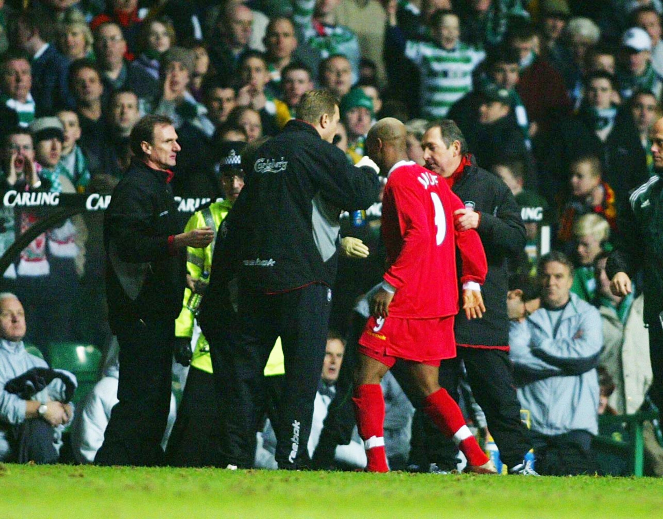 GLASGOW - MARCH 13:  El Hadji Diouf of Liverpool leaves the field after his incident in the crowd during the Glasgow Celtic v Liverpool UEFA Cup Quarter Final match at Celtic Park in Glasgow, Scotland on March 13, 2003. (Photo by Ben Radford/Getty Images)