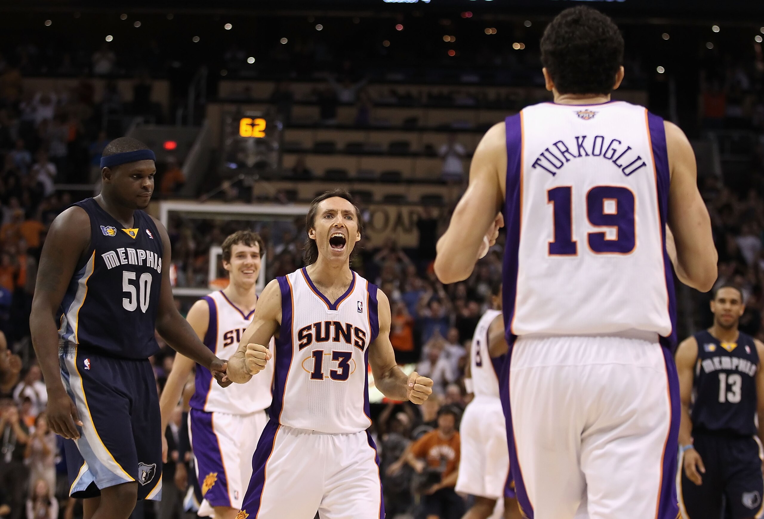 PHOENIX - DECEMBER 08:  Steve Nash #13 of the Phoenix Suns reacts after Hedo Turkoglu #19 hit a go ahead three point shot in the final moments of the NBA game against the Memphis Grizzlies at US Airways Center on December 8, 2010 in Phoenix, Arizona. The