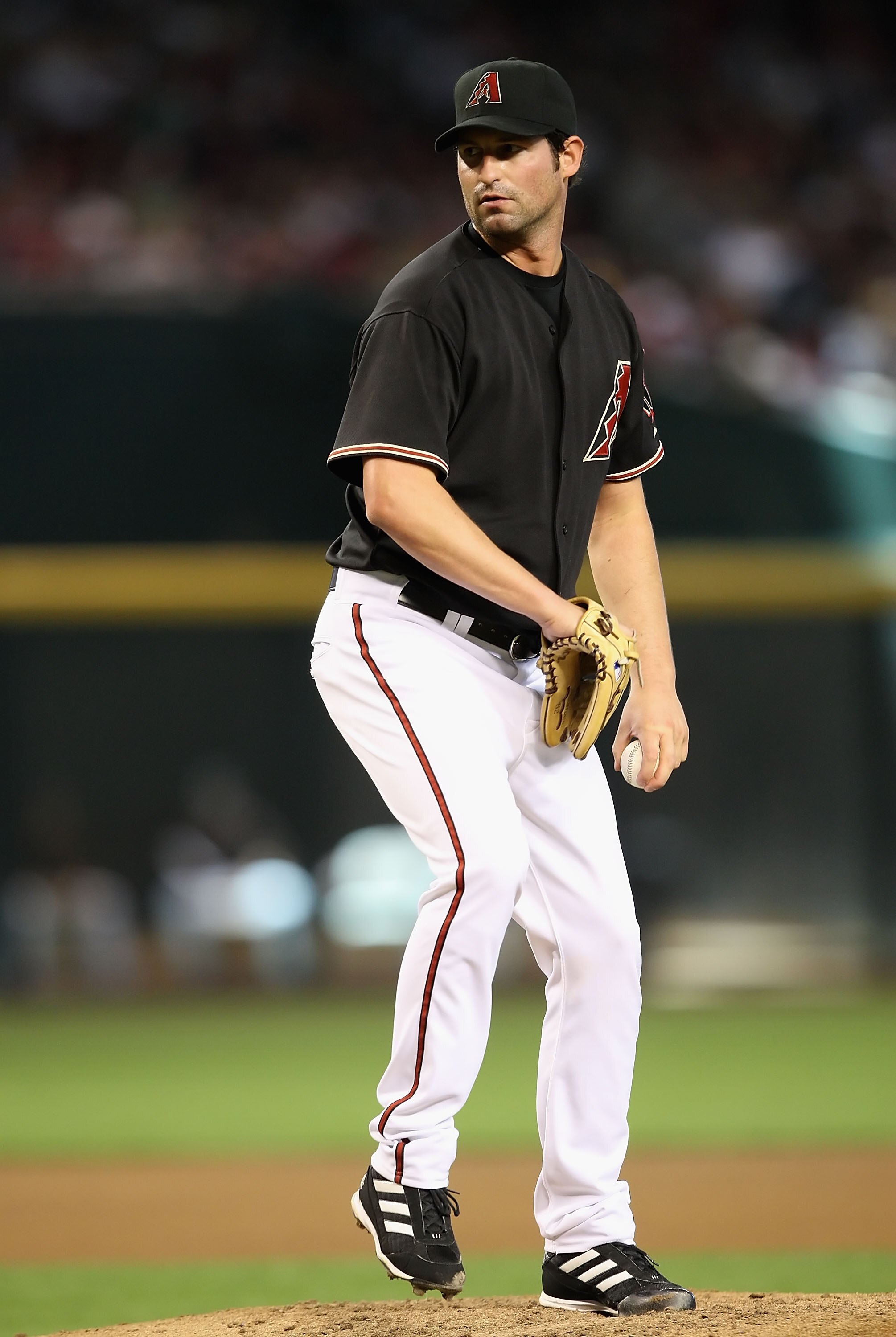 PHOENIX - MAY 30:  Starting pitcher Doug Davis #49 of the Arizona Diamondbacks pitches against the Atlanta Braves during the major league baseball game at Chase Field on May 30, 2009 in Phoenix, Arizona. The Diamondbacks defeated the Braves 3-2.  (Photo b