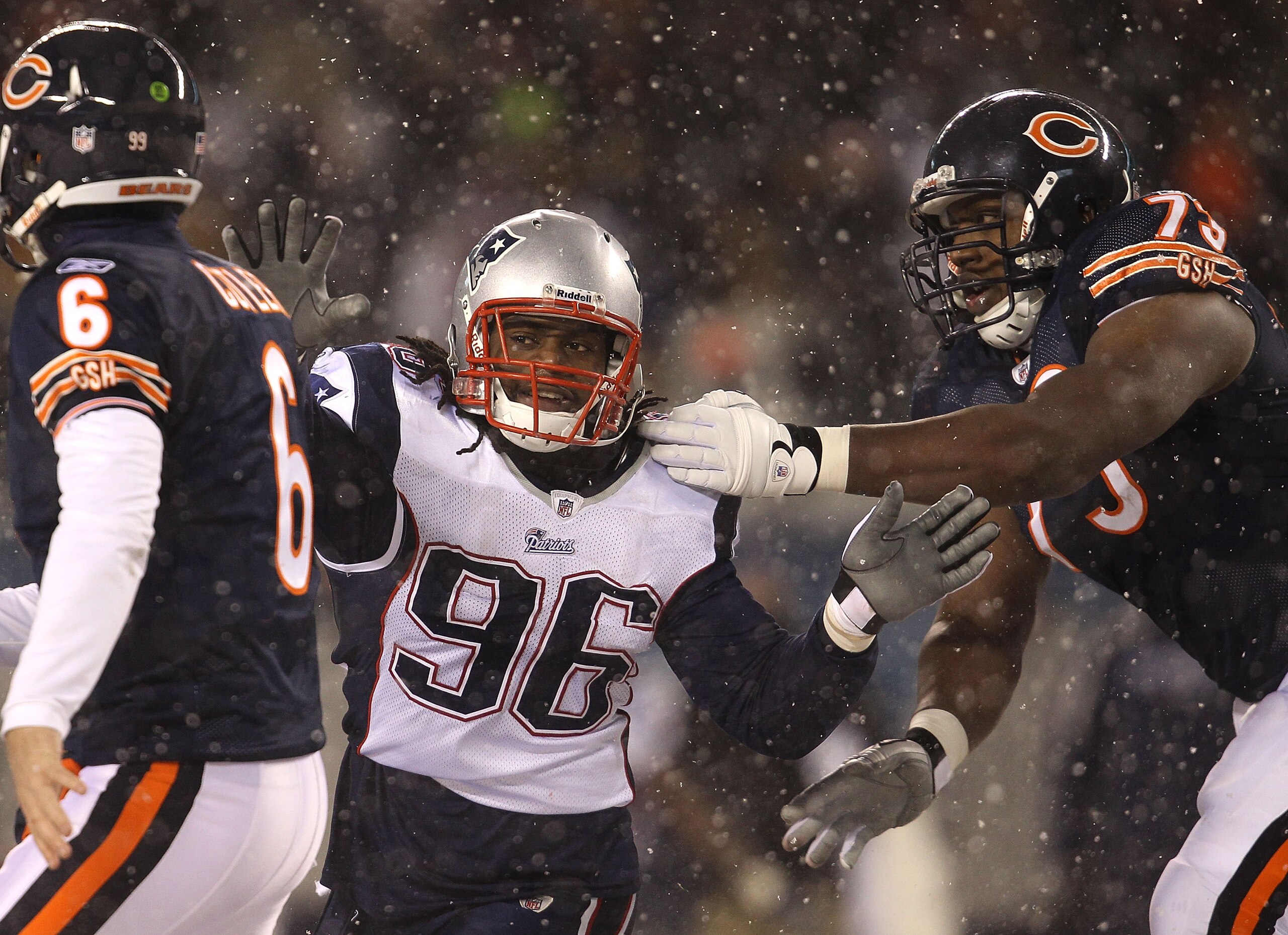 CHICAGO, IL - DECEMBER 12: Jermaine Cunningham #96 of the New England Patriots rushes past J'Marcus Webb #73 of the Chicago Bears towards Jay Cutler #6 at Soldier Field on December 12, 2010 in Chicago, Illinois. The Patriots defeated the Bears 36-7. (Phot