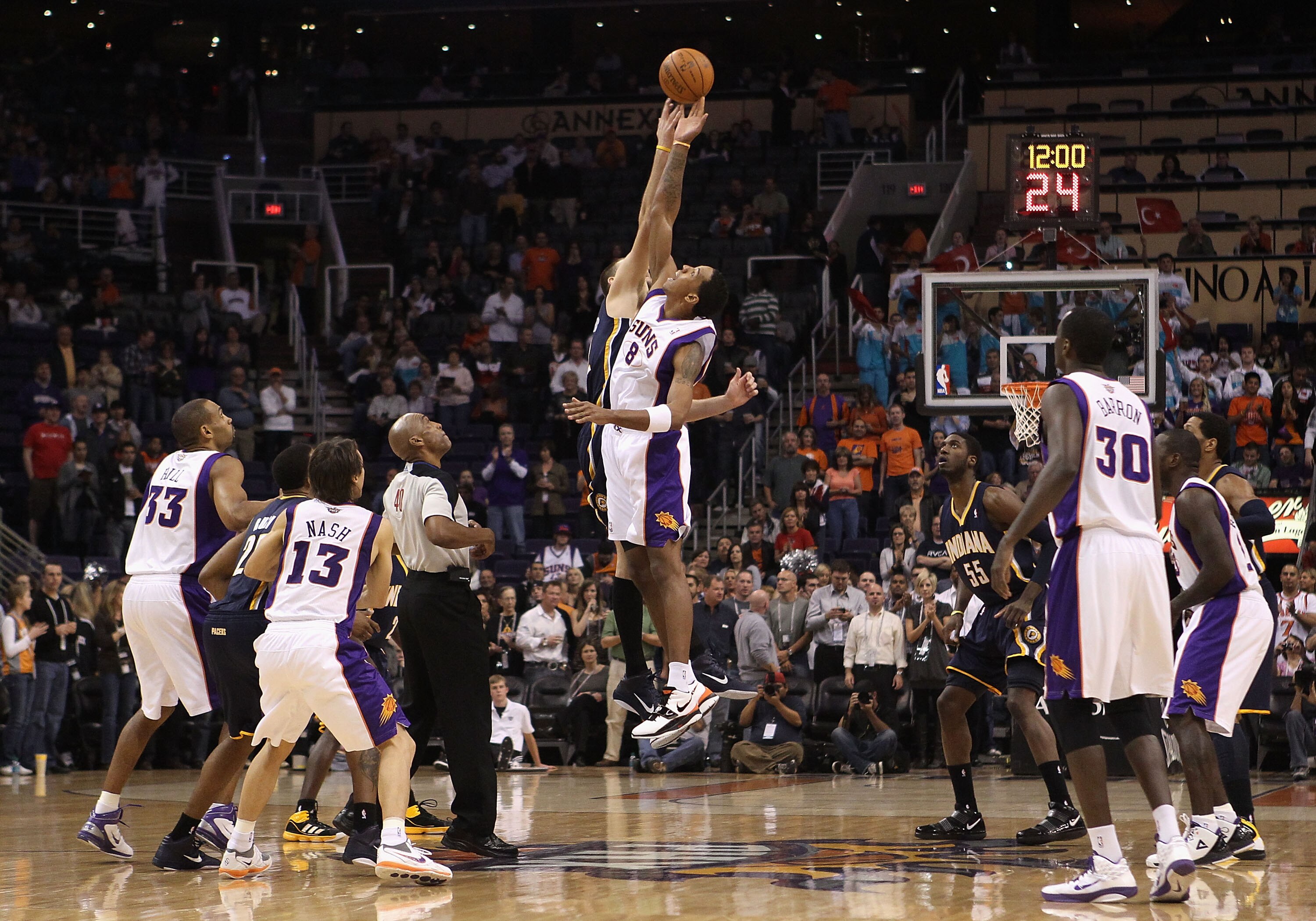 PHOENIX - DECEMBER 03:  Channing Frye #8 of the Phoenix Suns jumps for a tip off during the NBA game against the Indiana Pacers at US Airways Center on December 3, 2010 in Phoenix, Arizona. NOTE TO USER: User expressly acknowledges and agrees that, by dow