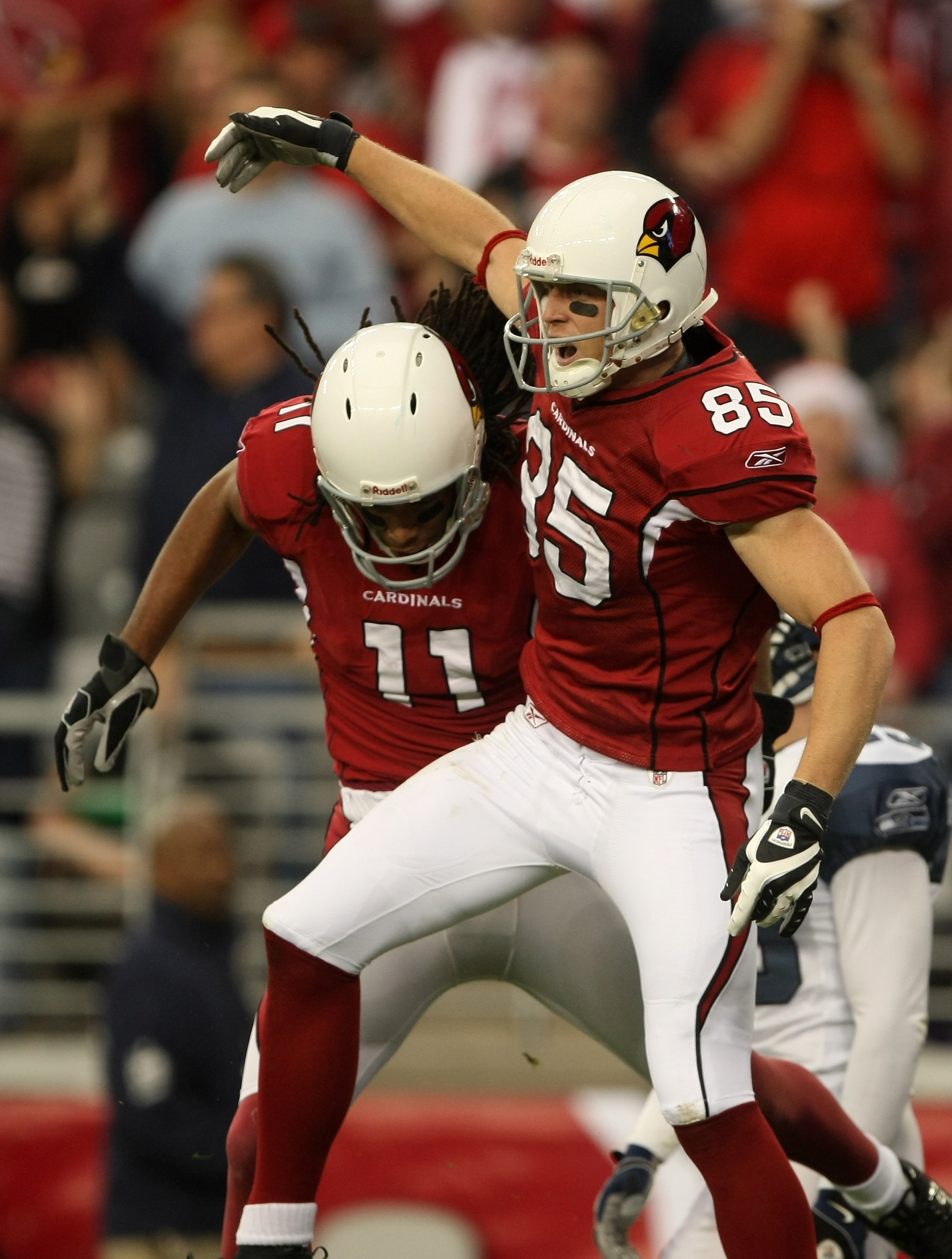 GLENDALE, AZ - DECEMBER 28:  Wide receivers Jerheme Urban #85 and Larry Fitzgerald #11 of the Arizona Cardinals celebrate after Urban's touchdown catch against the Seattle Seahawks on December 28, 2008 at University of Phoenix Stadium in Glendale, Arizona