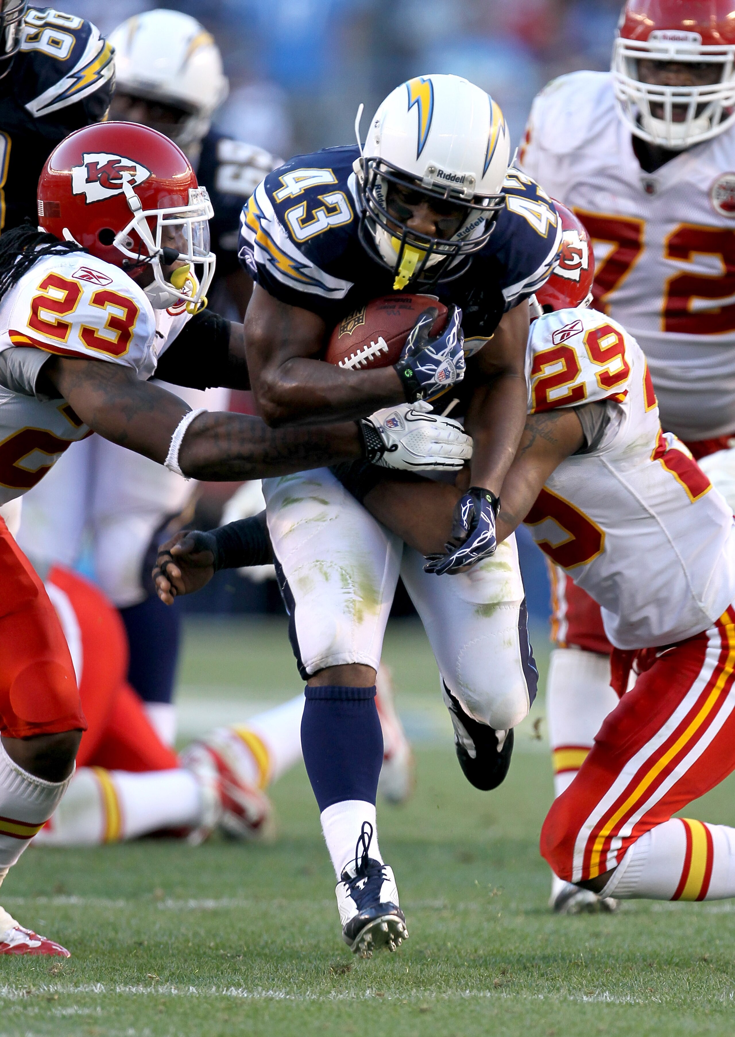 SAN DIEGO - DECEMBER 12: Running back Darren Sproles #43 of the San Diego Chargers carries the ball against safeties Eric Berry #29 and Kendrick Lewis #23 of the Kansas City Chiefs at Qualcomm Stadium on December 12, 2010 in San Diego, California.  the Ch