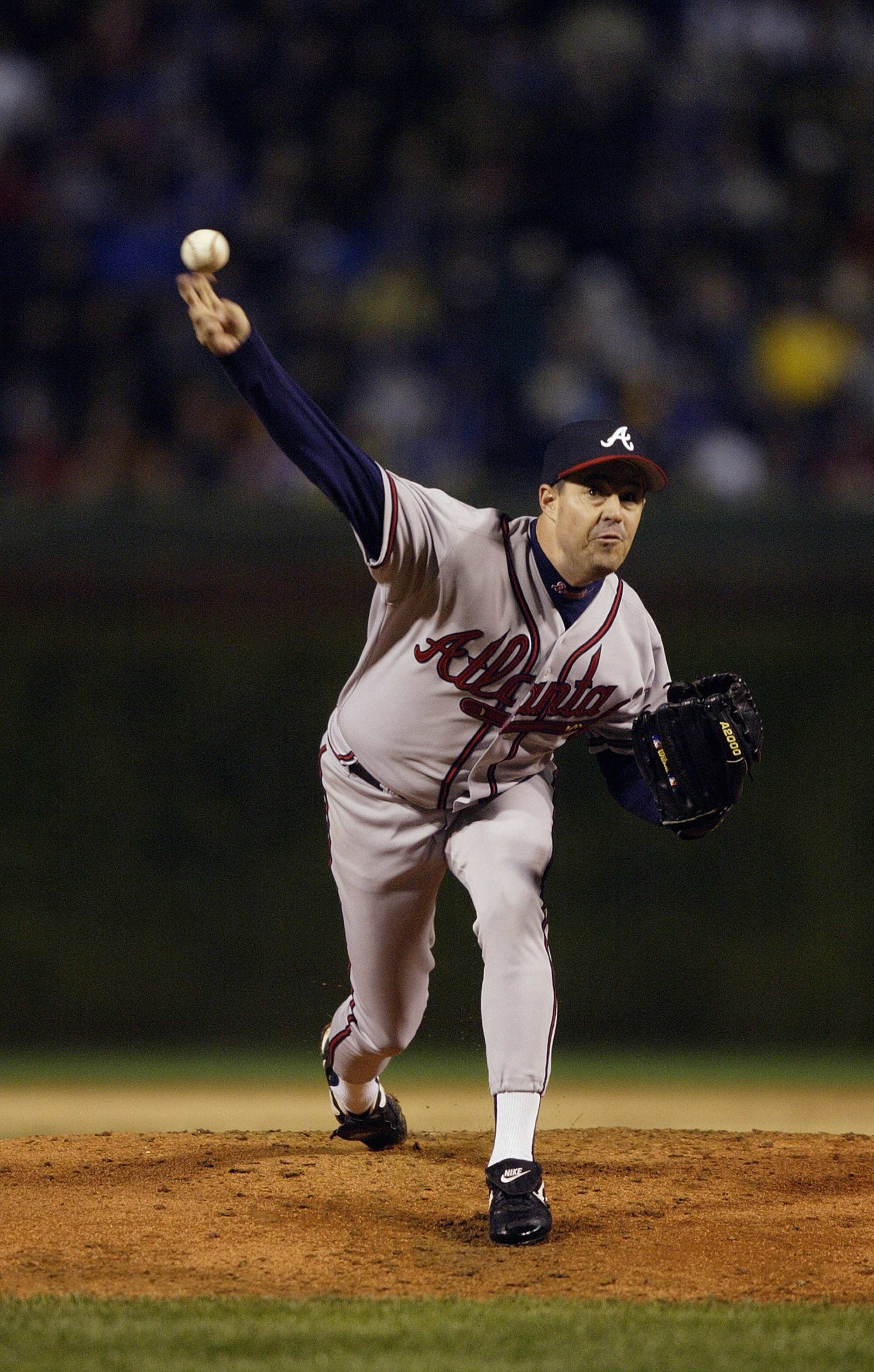 CHICAGO - OCTOBER 3:  Starting pitcher Greg Maddux of the Atlanta Braves throws against the Chicago Cubs during game three of the National League Division Series on October 3, 2003 at Wrigley Field in Chicago, Illinois.  The Cubs defeated the Braves 3-1.