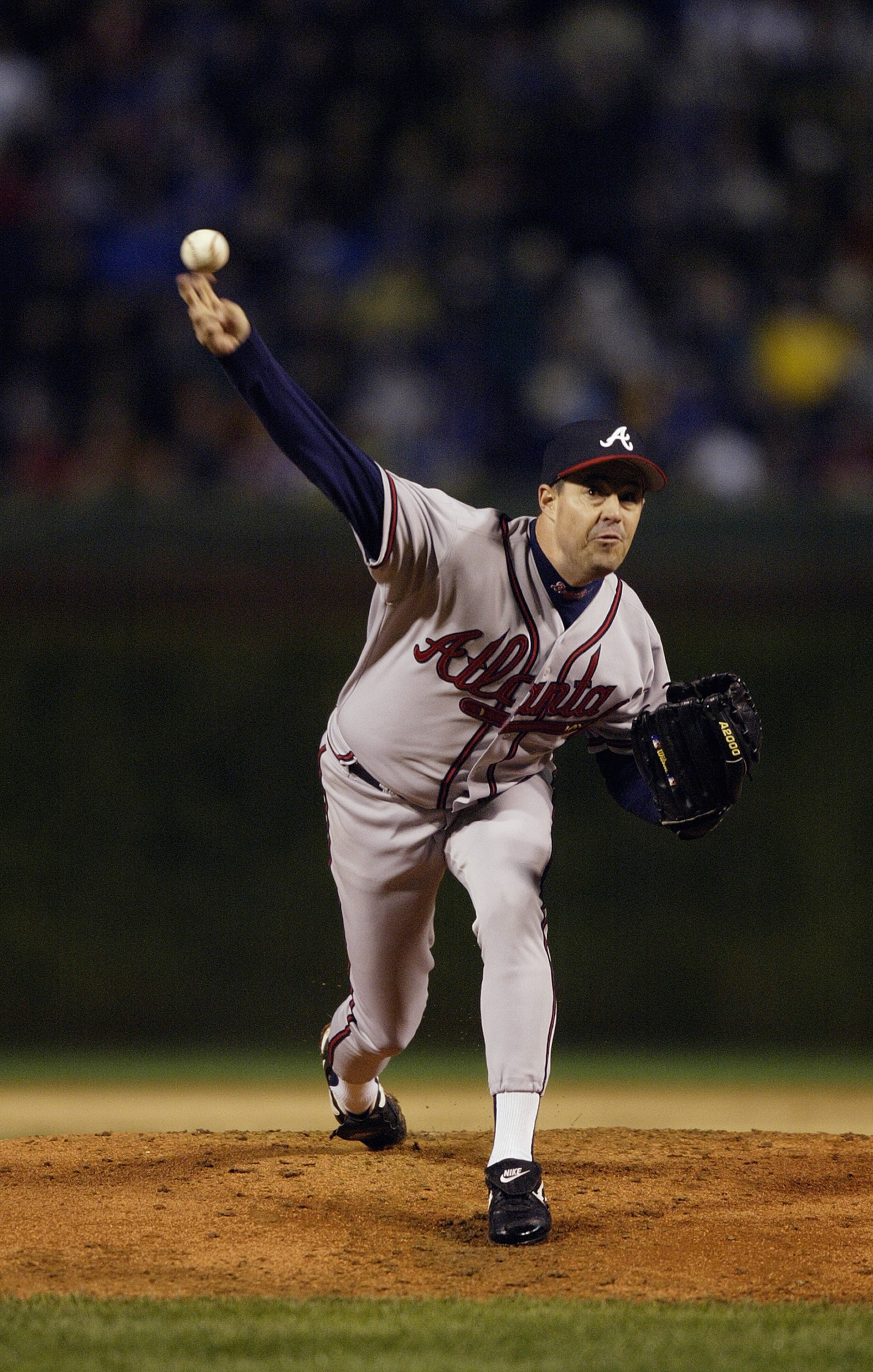 CHICAGO - OCTOBER 3:  Starting pitcher Greg Maddux of the Atlanta Braves throws against the Chicago Cubs during game three of the National League Division Series on October 3, 2003 at Wrigley Field in Chicago, Illinois.  The Cubs defeated the Braves 3-1.