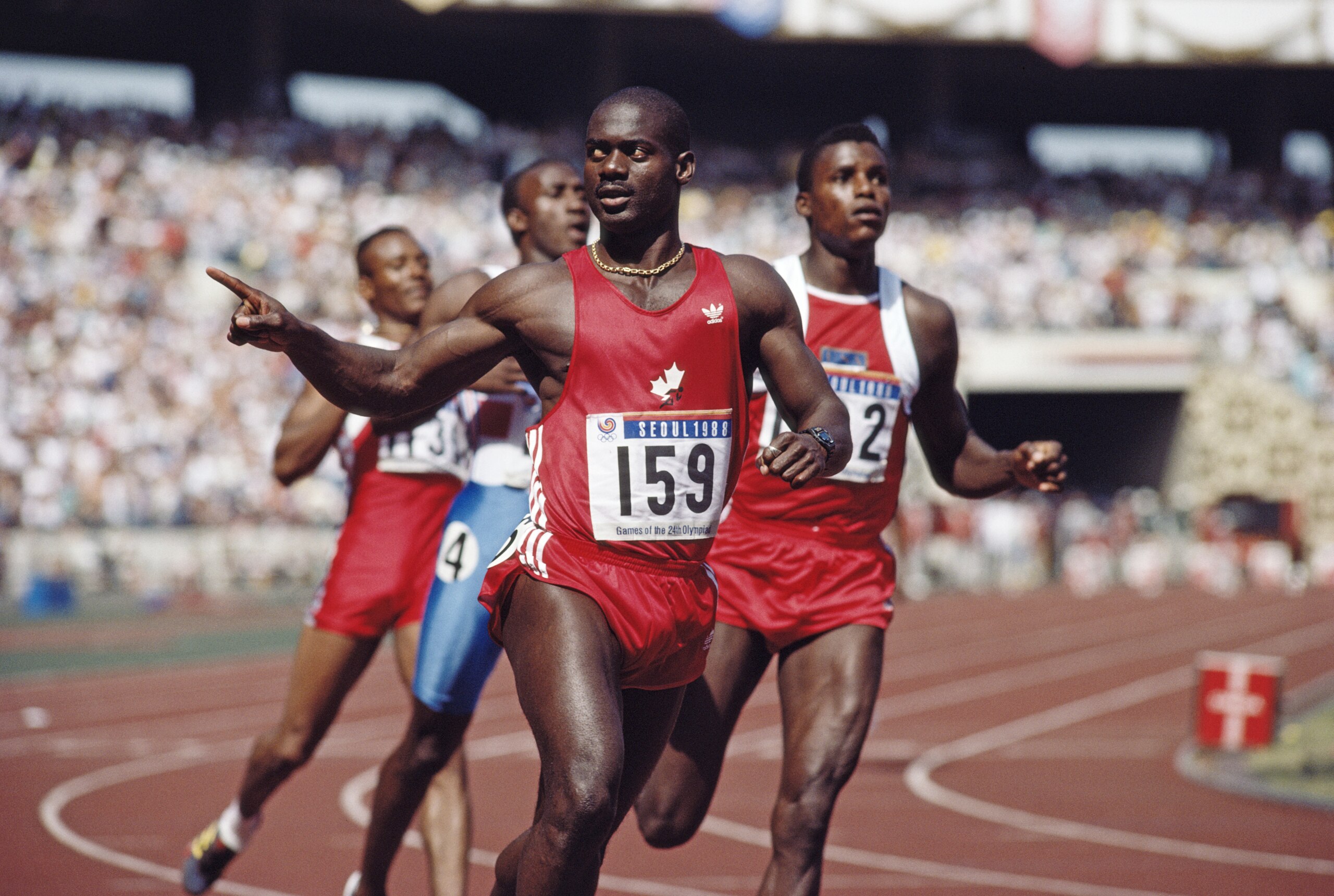 Ben Johnson of Canada celebrates winning gold in the Men's 100 metres final on 24 September 1988 during the  XXIV Olympic Games at the Seoul Olympic Stadium in Seoul, South Korea. Ben Johnson was later disqualified for the illegal use of performance enhan