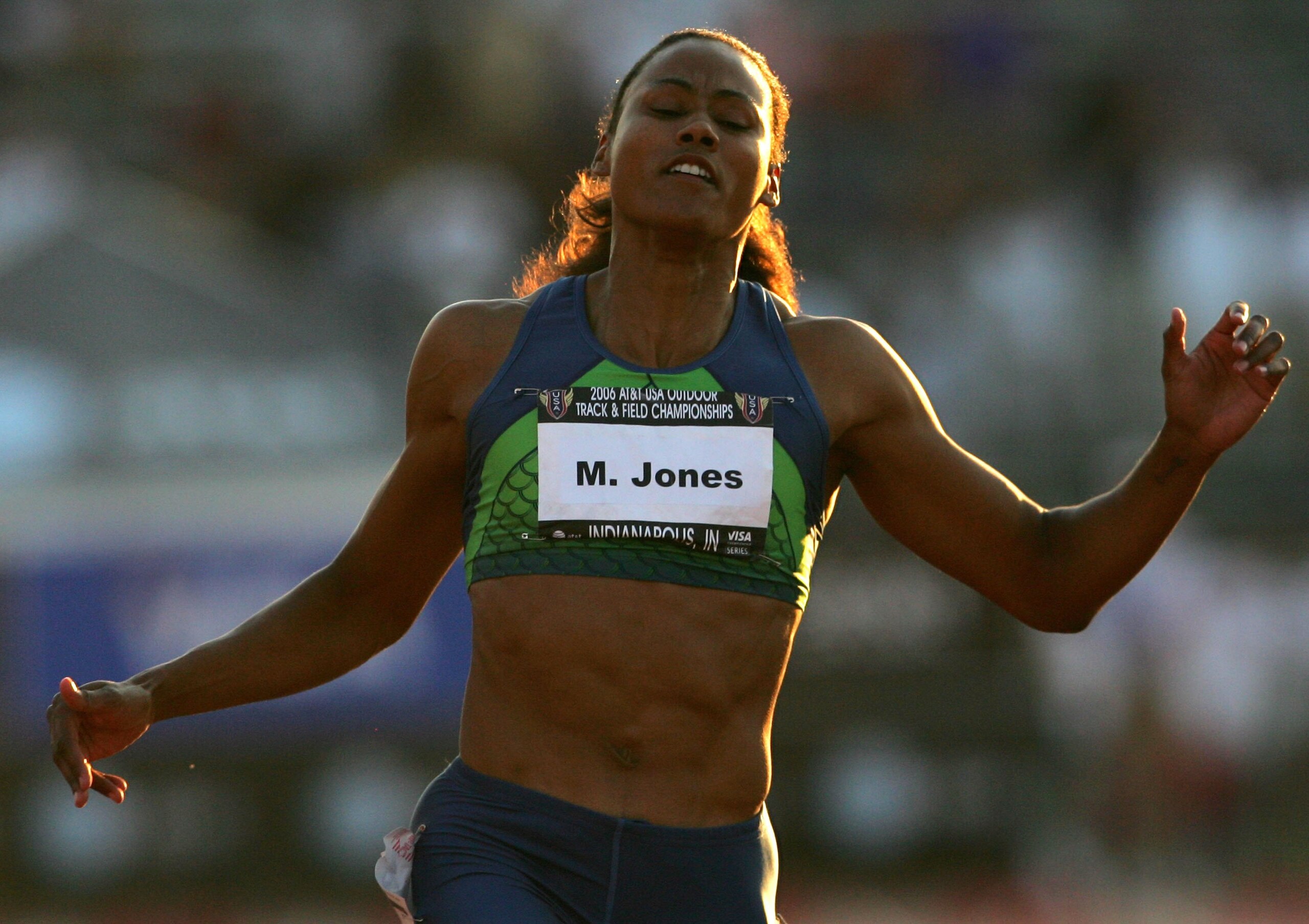 INDIANAPOLIS - JUNE 23:  Marion Jones crosses the finish line to win the 100 meter dash final on day two of the AT&T USA Outdoor Track and Field Championships at Indiana University Track and Field Stadium on June 23, 2006 in Indianapolis, Indiana.  (Photo