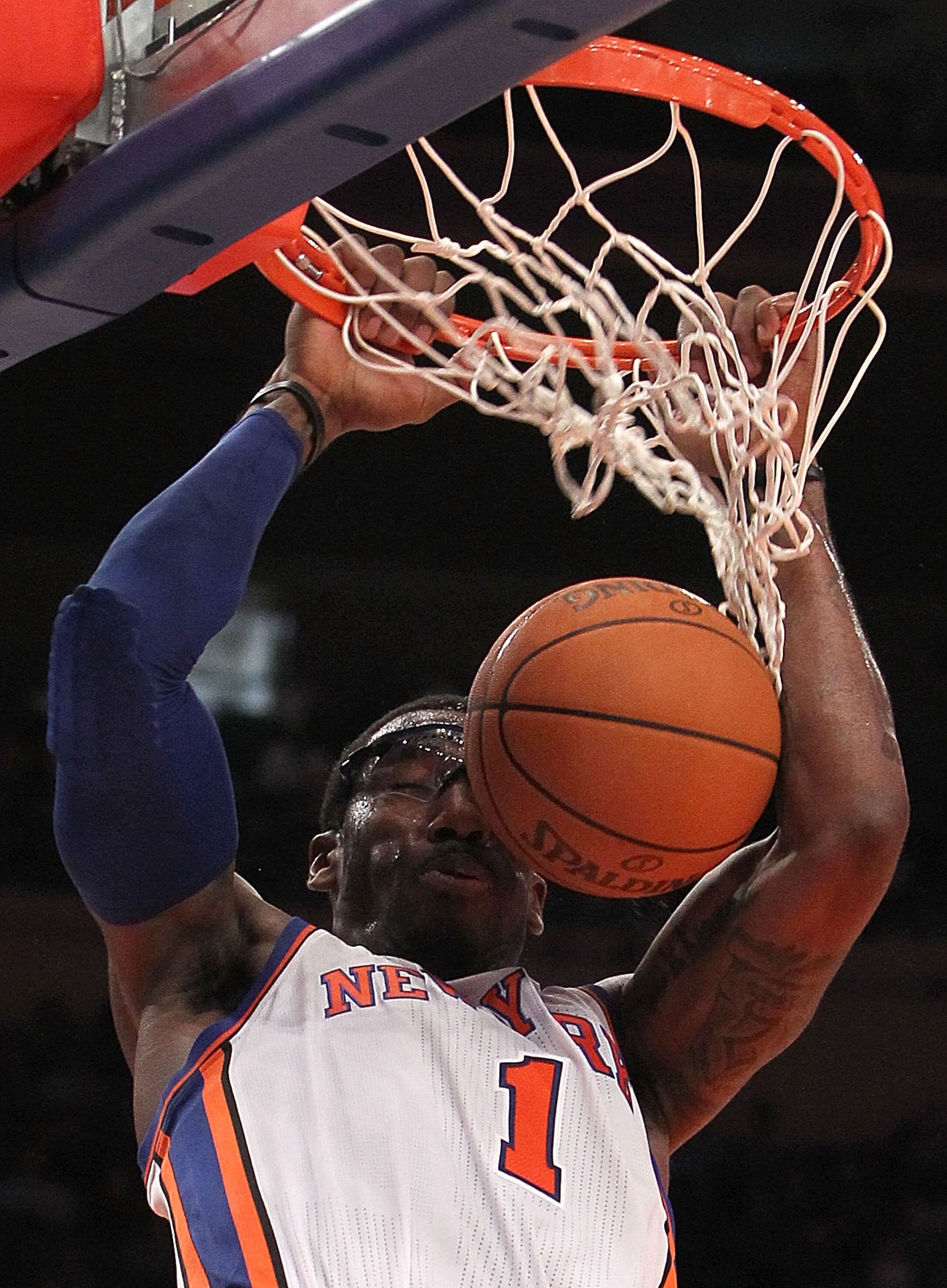 NEW YORK, NY - NOVEMBER 30:  Amar'e Stoudemire #1 of the New York Knicks dunks the ball against the New Jersey Nets on November 30, 2010 at Madison Square Garden in New York City. NOTE TO USER: User expressly acknowledges and agrees that, by downloading a