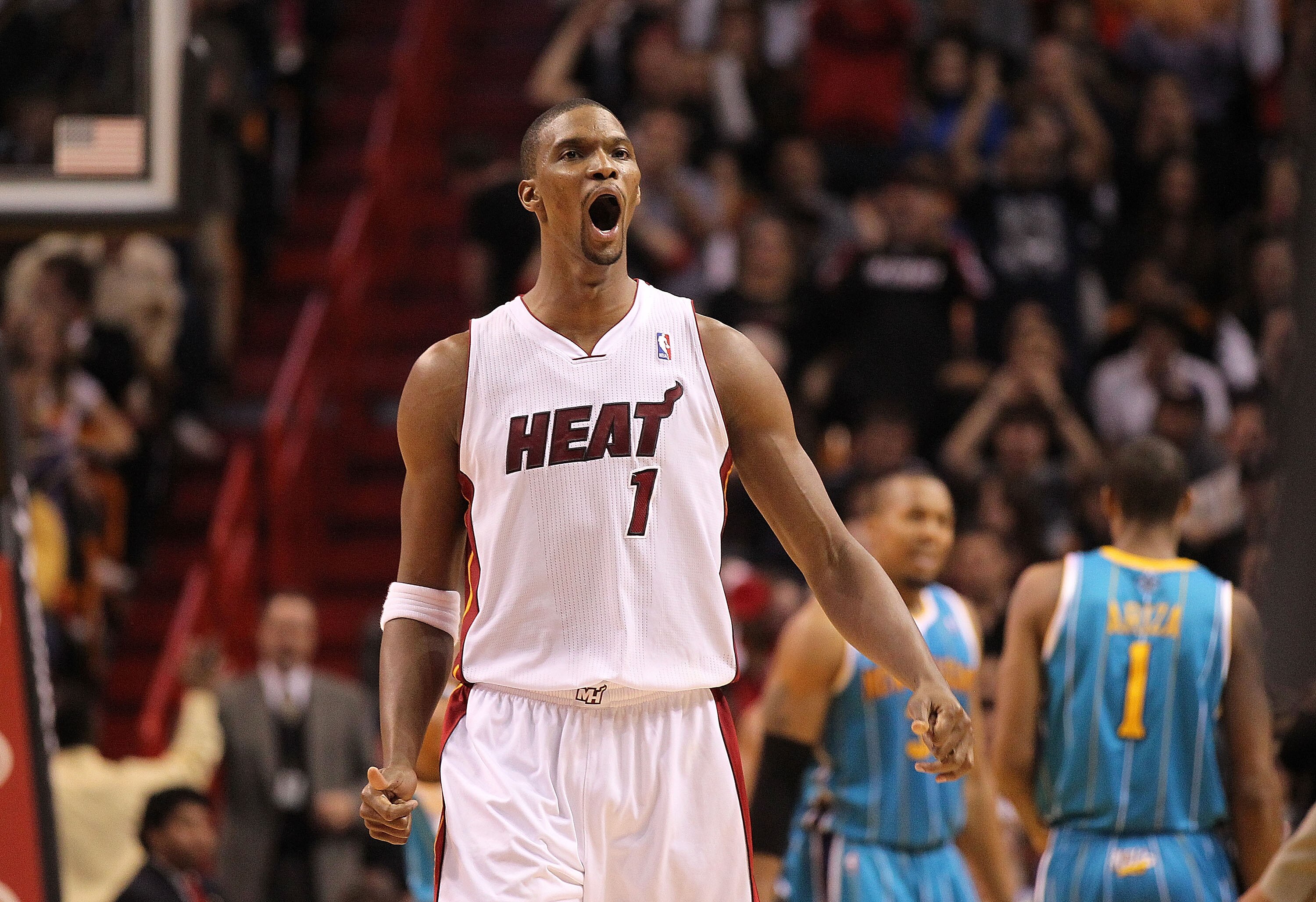 MIAMI, FL - DECEMBER 13:  Chris Bosh #1 of the Miami Heat reacts after making a 3 pointer during a game against the New Orleans Hornets at American Airlines Arena on December 13, 2010 in Miami, Florida. NOTE TO USER: User expressly acknowledges and agrees