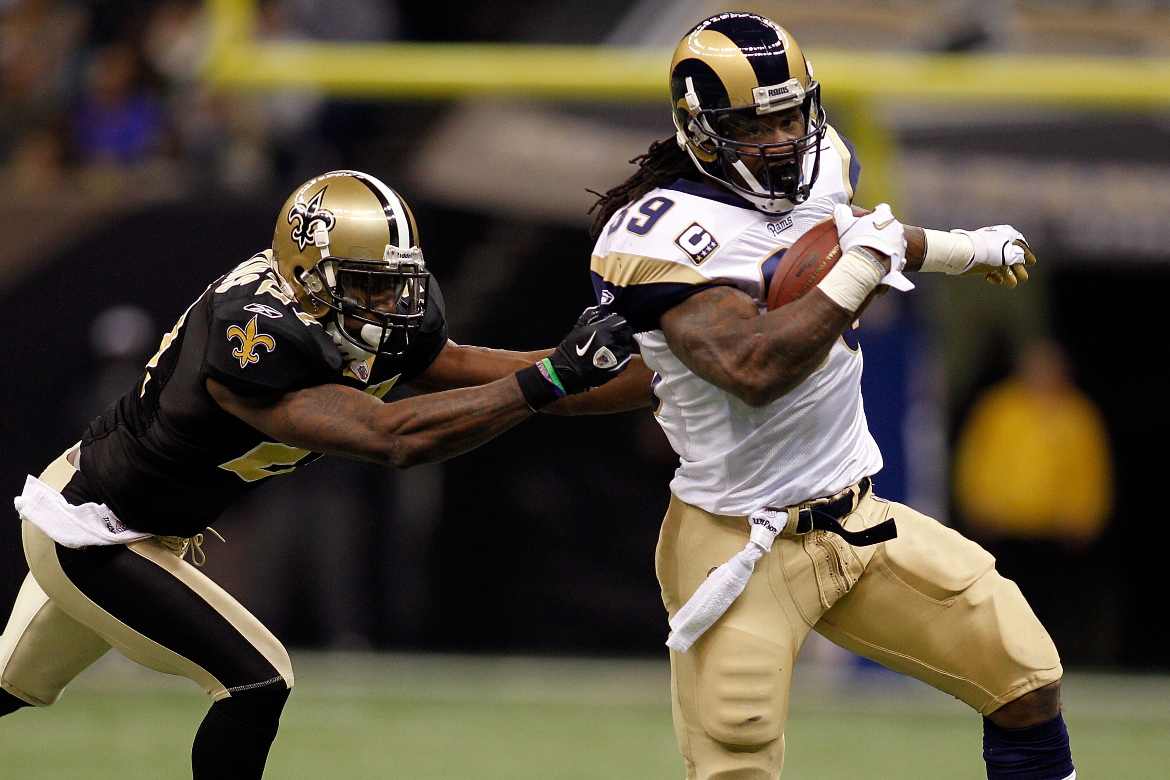 NEW ORLEANS, LA - DECEMBER 12:  Steven Jackson #39 of the St. Louis Rams is tackled by Malcom Jenkins #27 of the New Orleans Saints at the Louisiana Superdome on December 12, 2010 in New Orleans, Louisiana.  (Photo by Chris Graythen/Getty Images)