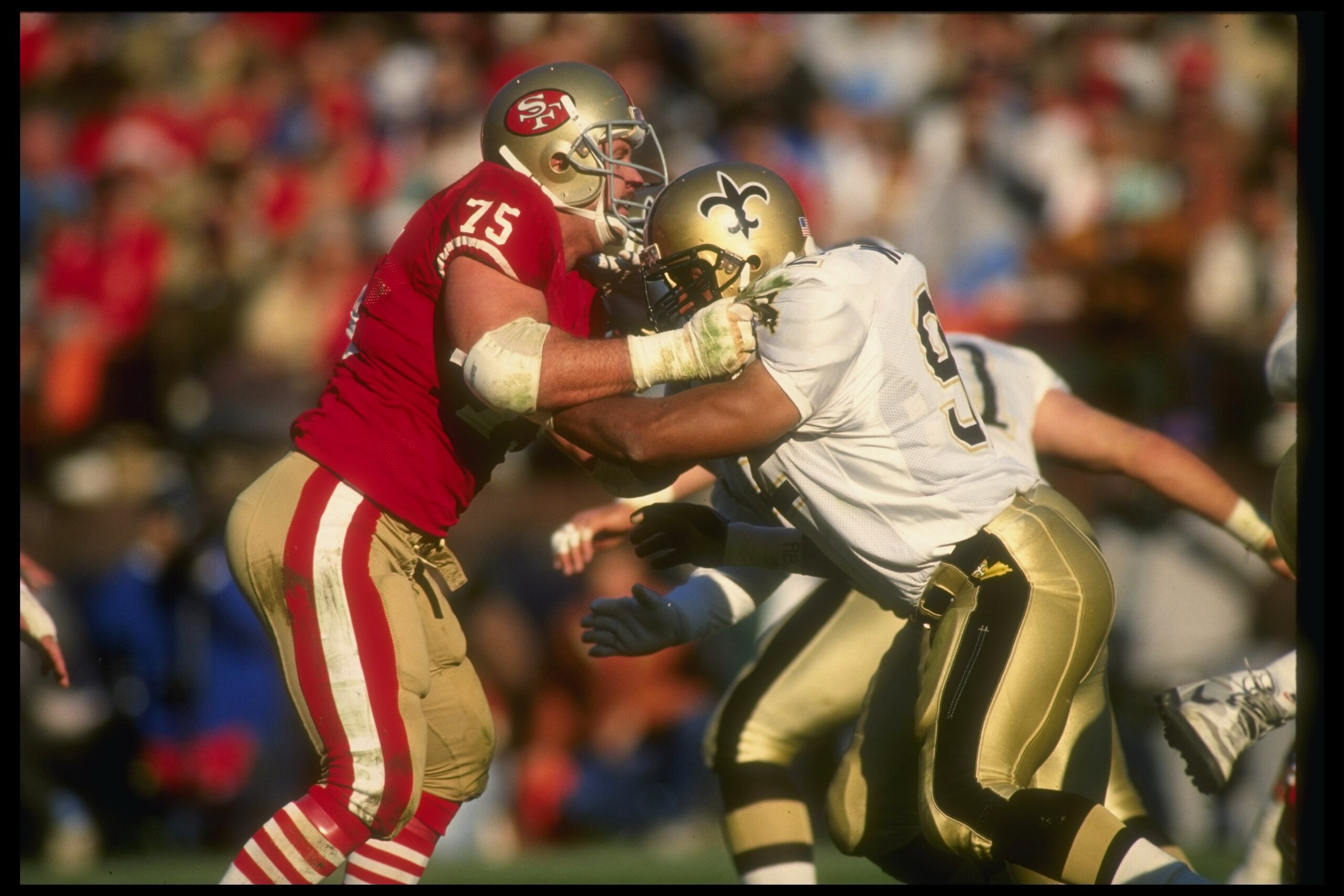 23 Dec 1990:  Defensive lineman Kevin Fagan of the San Francisco 49ers (left) works against the New Orleans Saints during a game at Candlestick Park in San Francisco, California.  The Saints won the game, 13-10. Mandatory Credit: Otto Greule  /Allsport