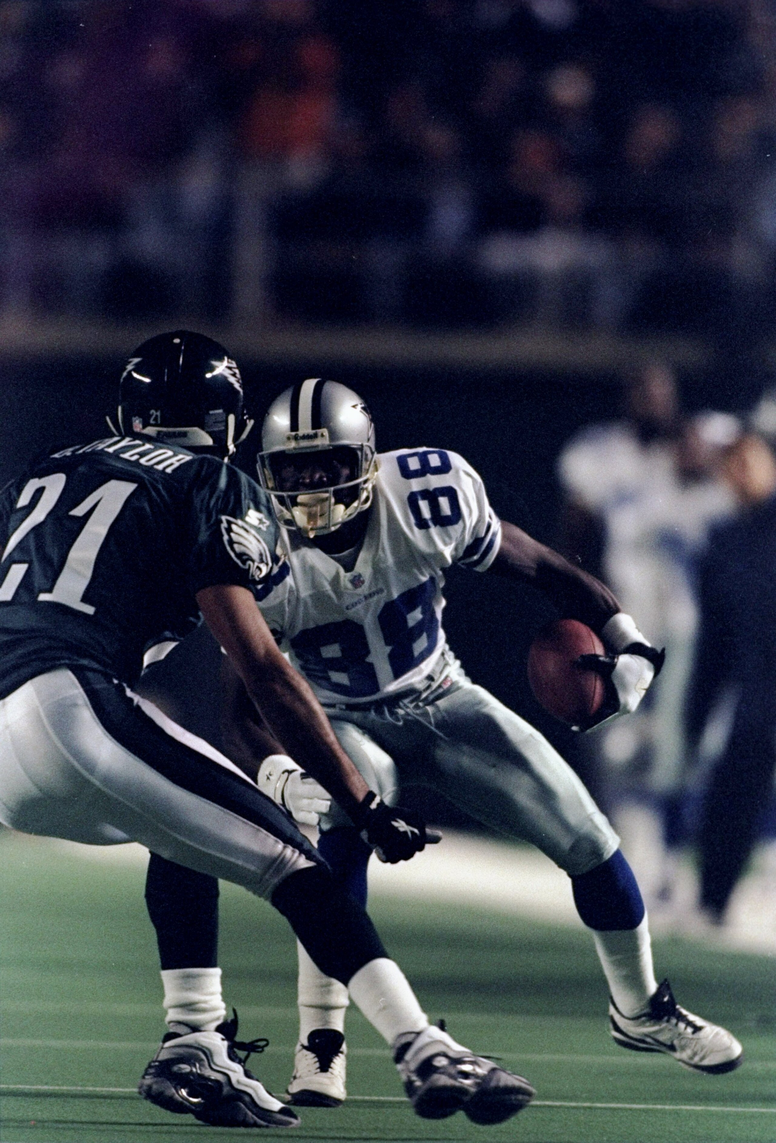 2 Nov 1998:  Wide receiver Michael Irvin #88 of the Dallas Cowboys attempts to run around Bobby Taylor #21 of the Philadelphia Eagles during the game at the Veterans Stadium in Philadelphia, Pennsylvania. The Cowboys defeated the Eagles 34-0.