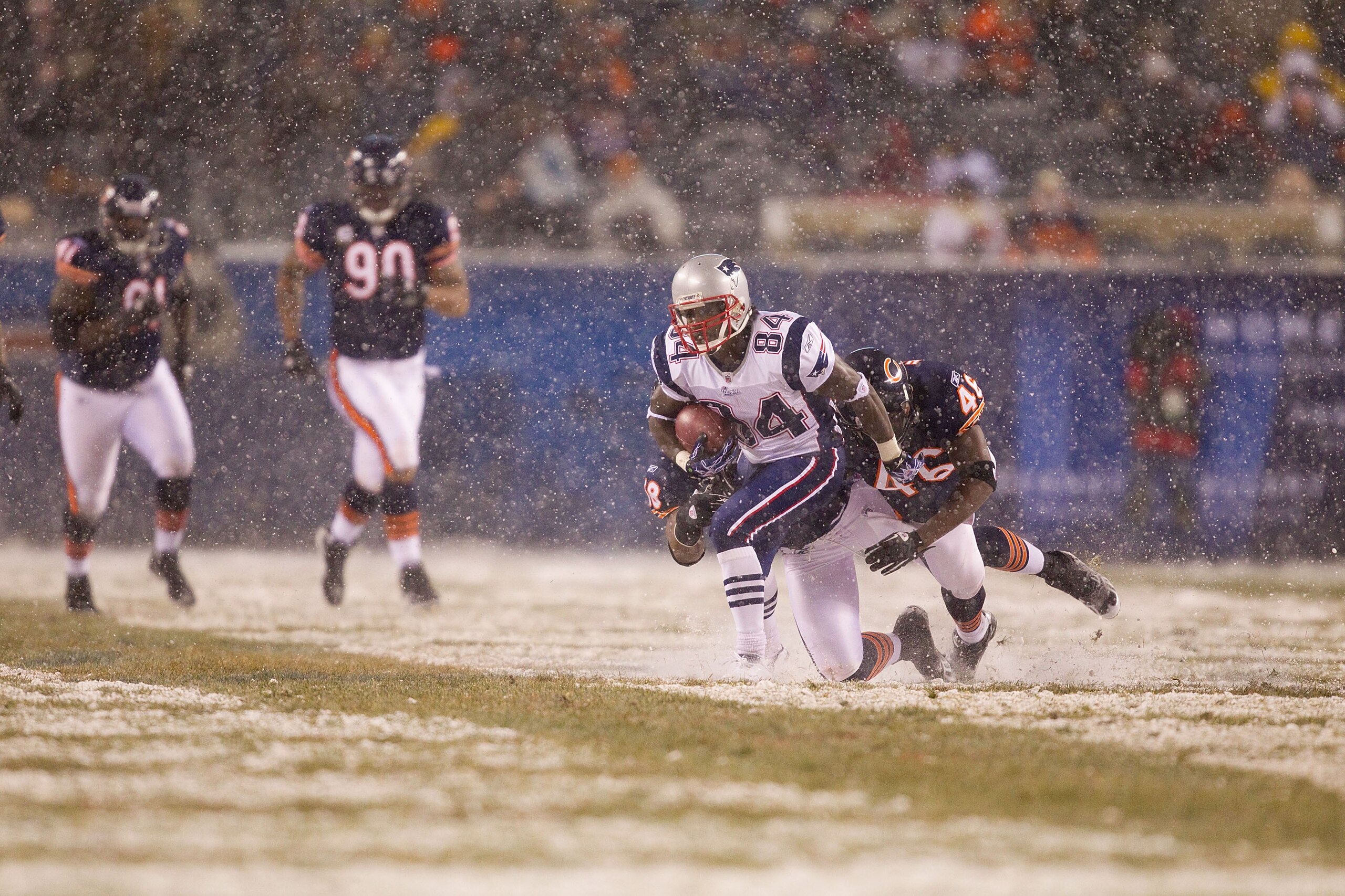 CHICAGO, IL - DECEMBER 12: Deion Branch #84 of the New England Patriots catches a pass against the Chicago Bears at Soldier Field on December 12, 2010 in Chicago, Illinois.  The Patriots beat the Bears 36-7.  (Photo by Dilip Vishwanat/Getty Images)