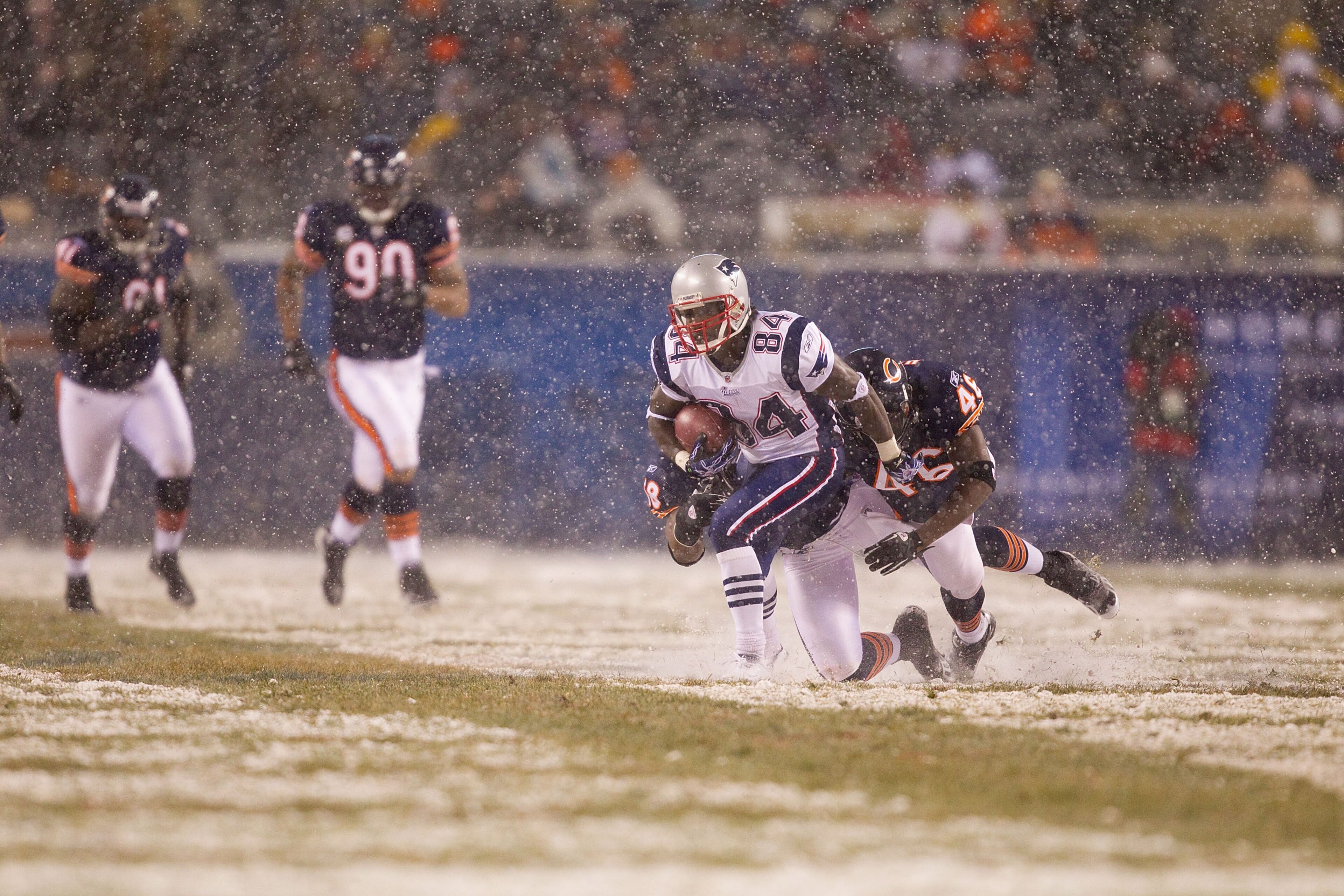 CHICAGO, IL - DECEMBER 12: Deion Branch #84 of the New England Patriots catches a pass against the Chicago Bears at Soldier Field on December 12, 2010 in Chicago, Illinois.  The Patriots beat the Bears 36-7.  (Photo by Dilip Vishwanat/Getty Images)