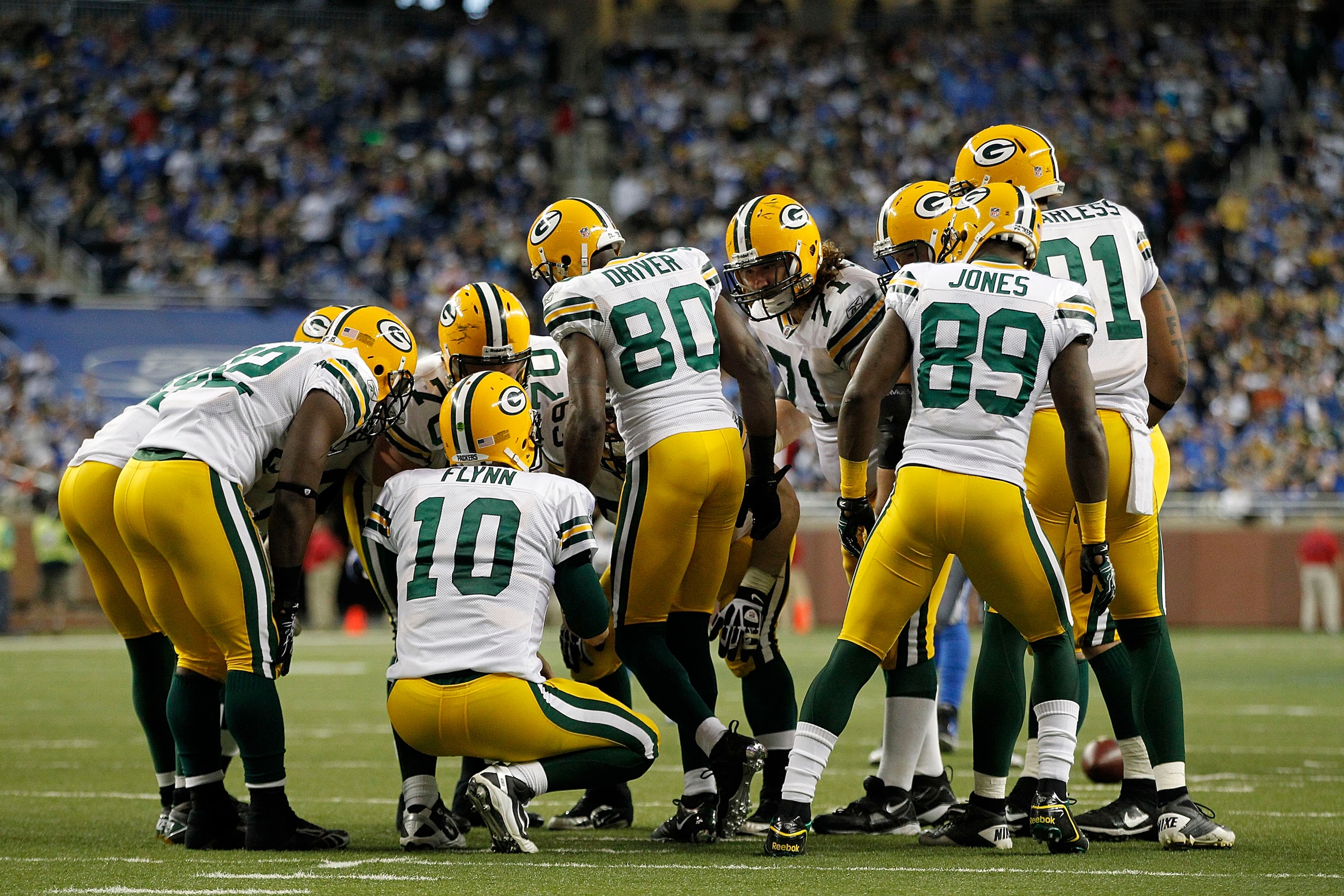DETROIT - DECEMBER 12:  Matt Flynn #10 of the Green Bay Packers calls the play in the huddle during the third quarter of the game against the Detroit Lions at Ford Field on December 12, 2010 in Detroit, Michigan. The Lions defeated the Packers 7-3.  (Phot