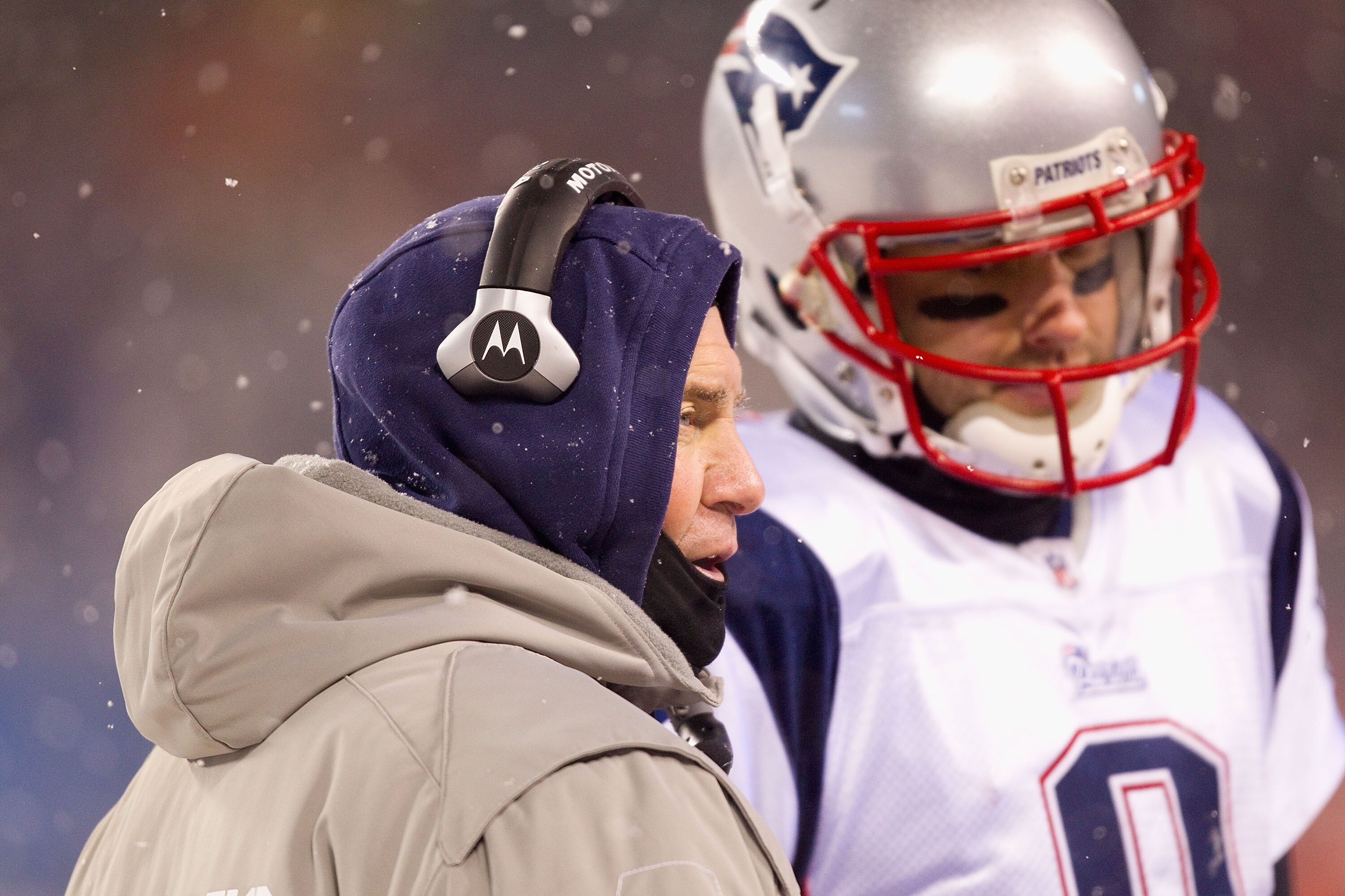 CHICAGO, IL - DECEMBER 12: Head coach Bill Belichick of the New England Patriots conducts a meeting during a time-out against the Chicago Bears at Soldier Field on December 12, 2010 in Chicago, Illinois.  The Patriots beat the Bears 36-7.  (Photo by Dilip
