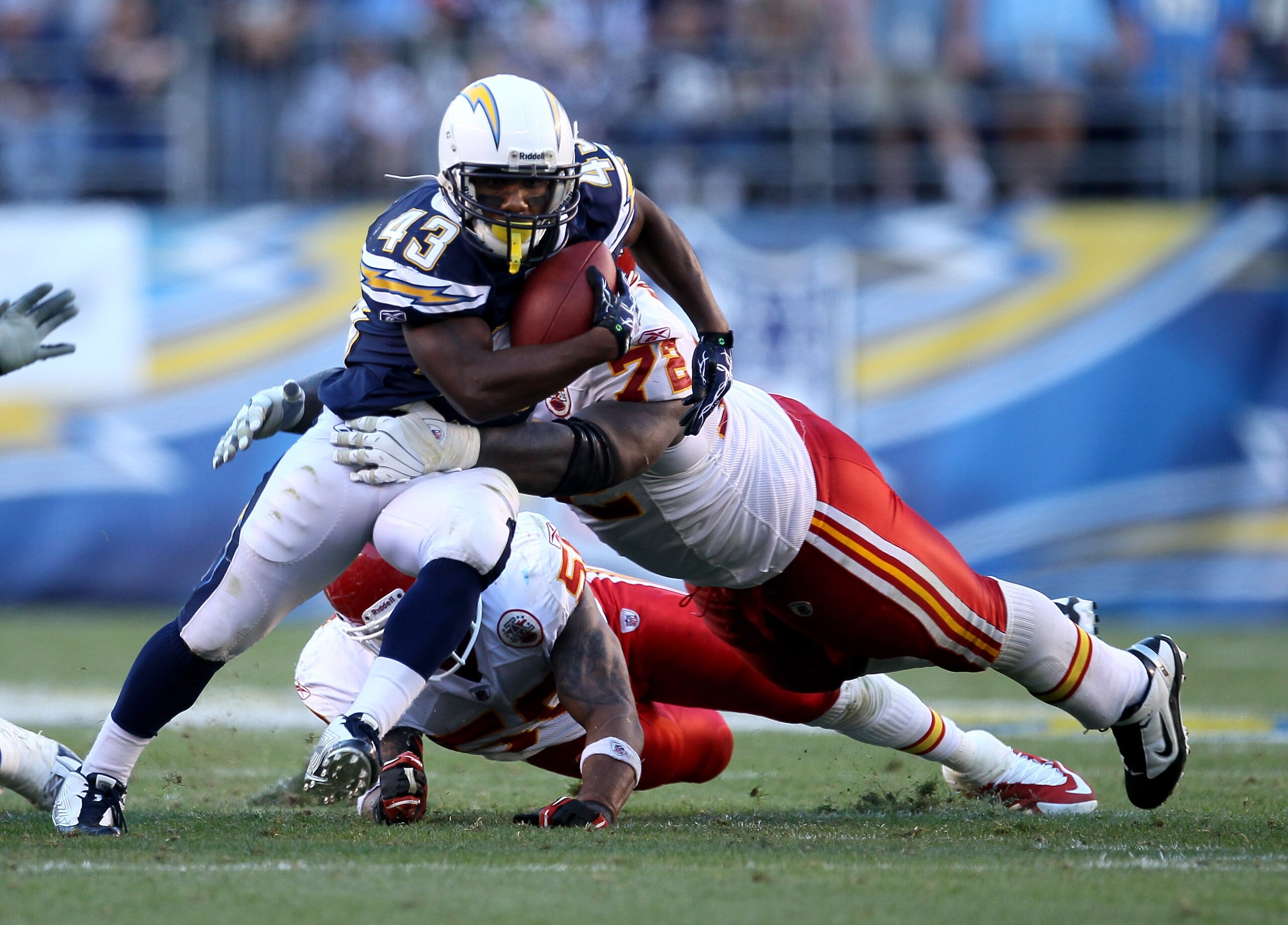 SAN DIEGO - DECEMBER 12:  Running back Darren Sproles #43 of the San Diego Chargers carries the ball against defensive end Glenn Dorsey #72 of the Kansas City Chiefs at Qualcomm Stadium on December 12, 2010 in San Diego, California.  the Chargers won 31-0