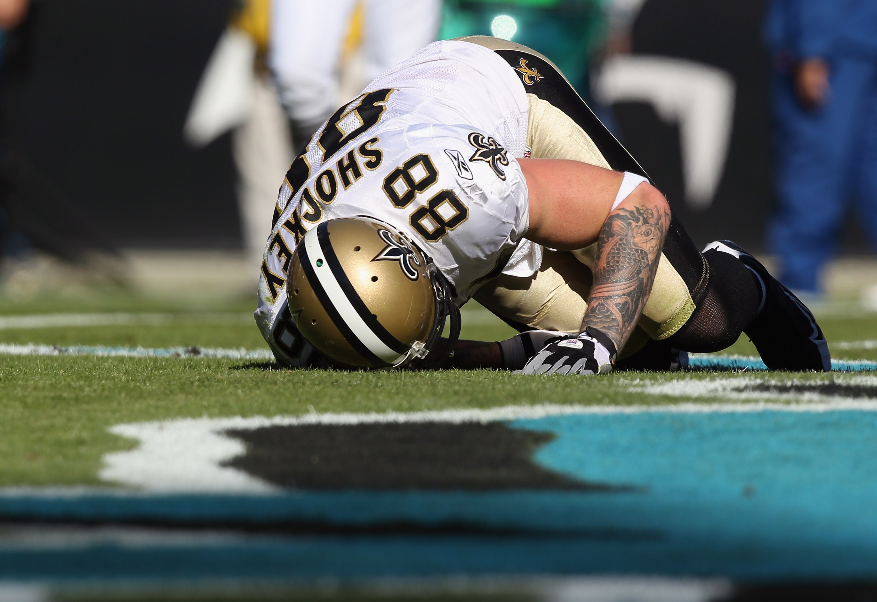 CHARLOTTE, NC - NOVEMBER 07:  Jeremy Shockey #88 of the New Orleans Saints is injured after a touchdown against the Carolina Panthers during their game at Bank of America Stadium on November 7, 2010 in Charlotte, North Carolina.  (Photo by Streeter Lecka/