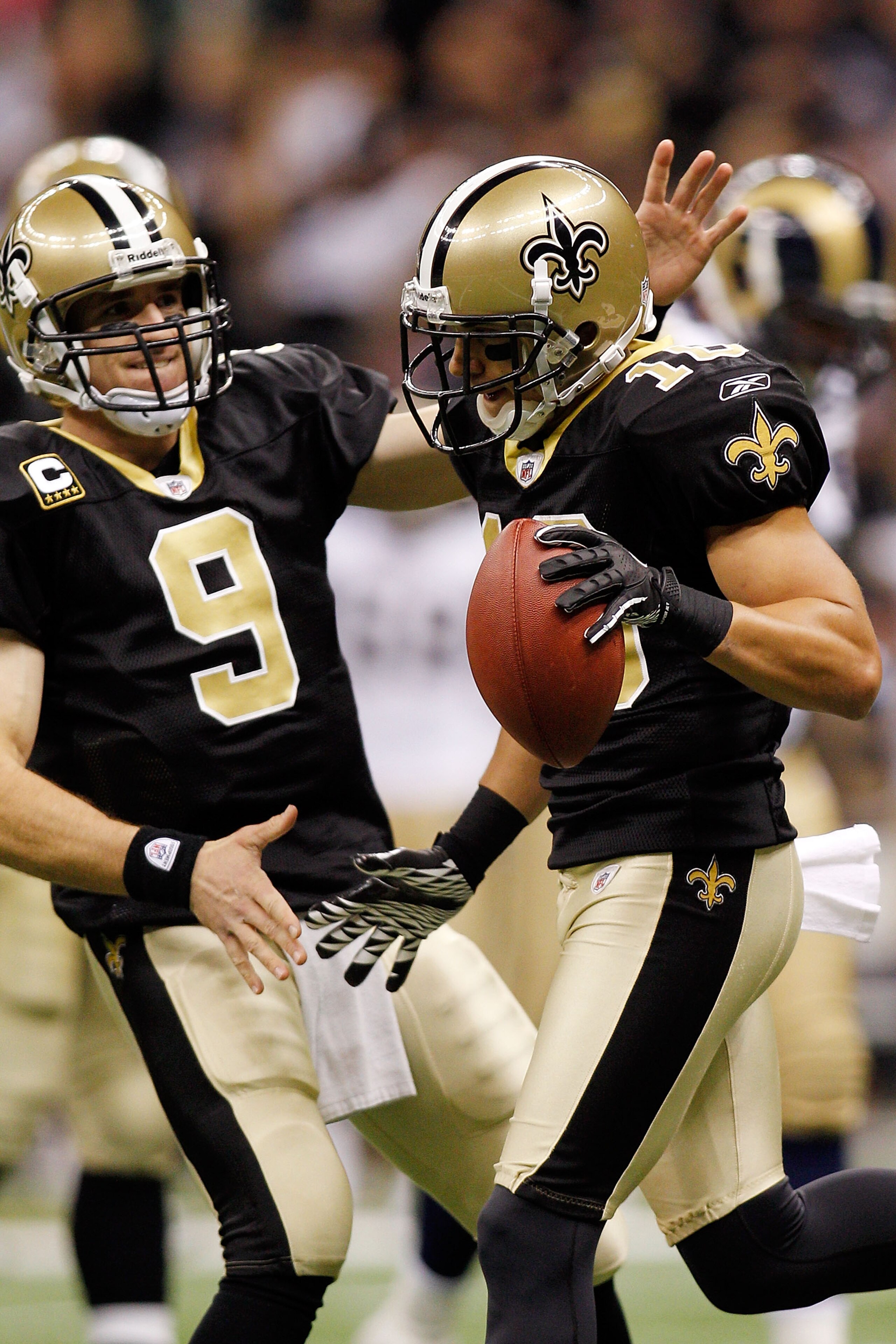 NEW ORLEANS, LA - DECEMBER 12:  Drew Brees #9 and Lance Moore #16 of the New Orleans Saints celebrate after scoring a touchdown against the St. Louis Rams at the Louisiana Superdome on December 12, 2010 in New Orleans, Louisiana. The Saints defeated the R