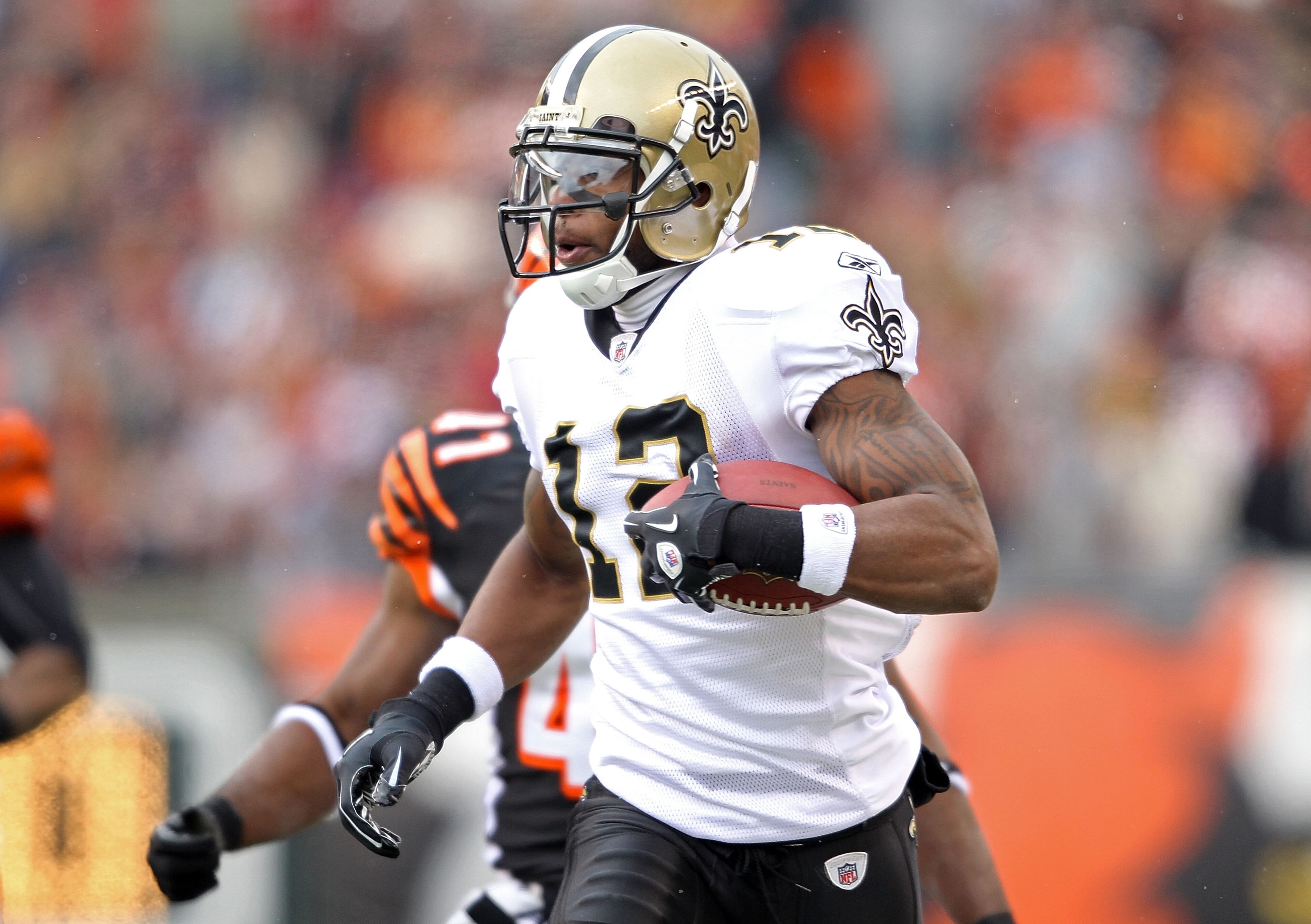 CINCINNATI, OH - DECEMBER 05:  Marques Colston #12 of the New Orleans Saints runs with the ball during the NFL game against the Cincinnati Bengals at Paul Brown Stadium on December 5, 2010 in Cincinnati, Ohio.  The Saints won 34-30.  (Photo by Andy Lyons/