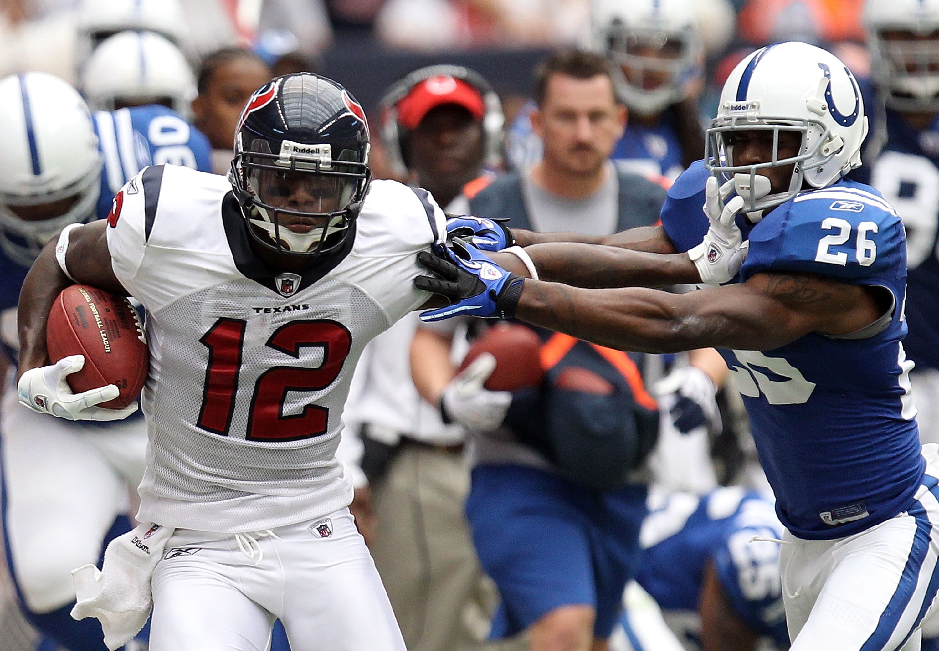 HOUSTON - SEPTEMBER 12:  Wide receiver Jacoby Jones #12 of the Houston Texans runs the ball past Kelvin Hayden #26 of the Indianapolis Colts at Reliant Stadium on September 12, 2010 in Houston, Texas.  (Photo by Ronald Martinez/Getty Images)