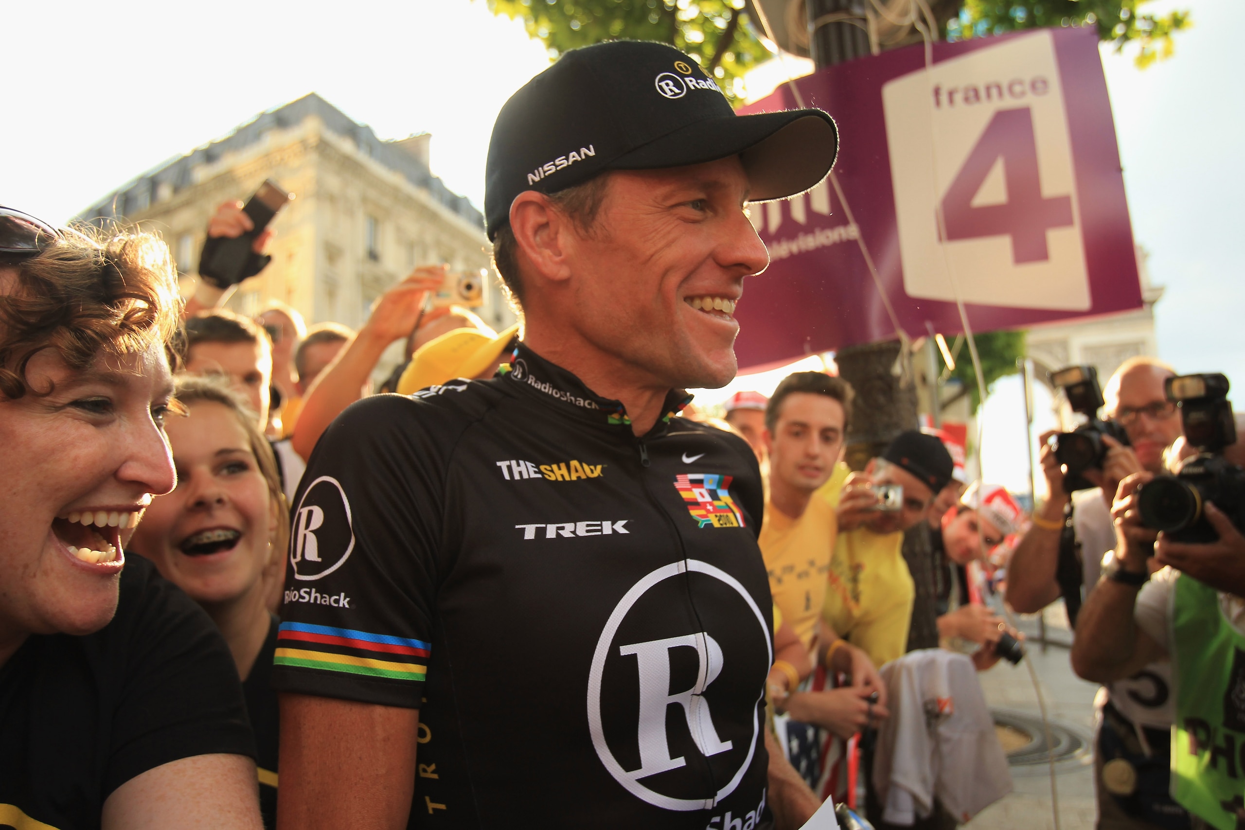 PARIS - JULY 25:  Lance Armstrong of team Radioshack poses with fans after the twentieth and final stage of Le Tour de France 2010, from Longjumeau to the Champs-Elysees in Paris on July 25, 2010 in Paris, France.  (Photo by Spencer Platt/Getty Images)