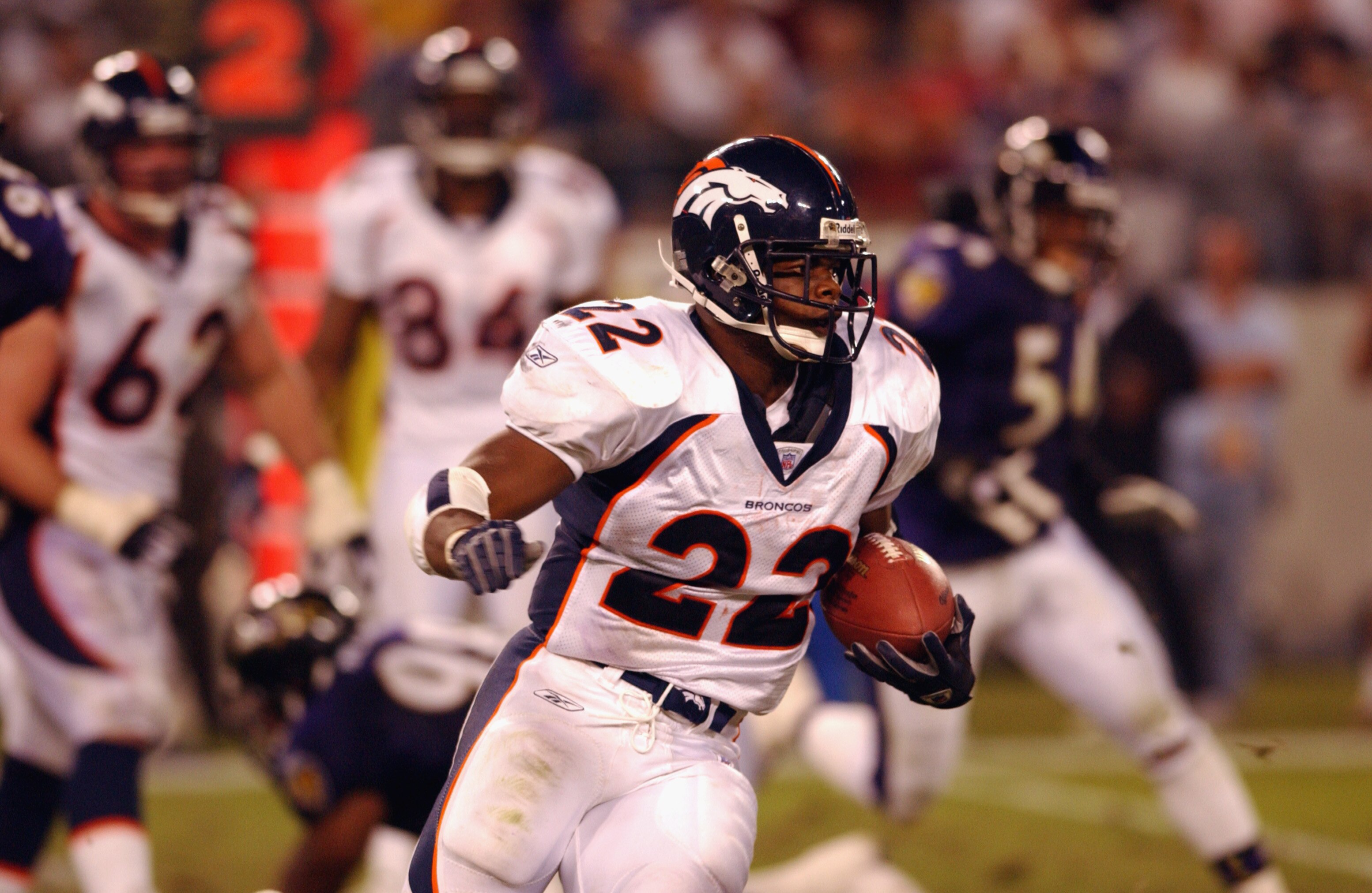 BALTIMORE - SEPTEMBER 30:  Running back Gary Olandis #22 of the Denver Broncos carries the ball up the field during NFL Monday Night Football game against the Baltimore Ravens on September 30, 2002 at Ravens Stadium in Baltimore, Maryland. The Ravens defe